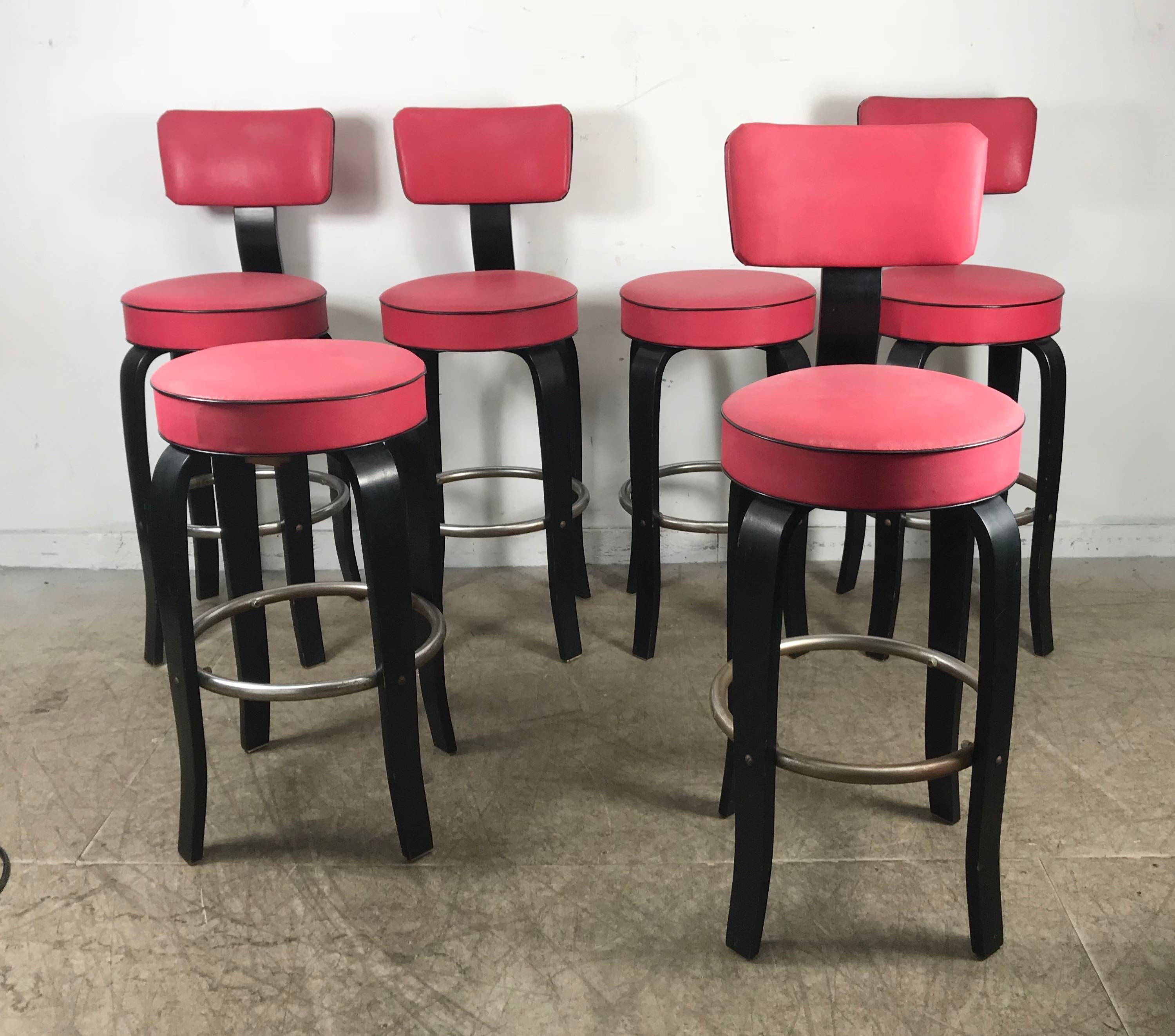 Midcentury bentwood bar or counter stools by national store fixture co. Black lacquered bent plywood. Chromed steel footrest, retains original salmon pink naugahyde seat and back in amazing condition, extremely comfortable.