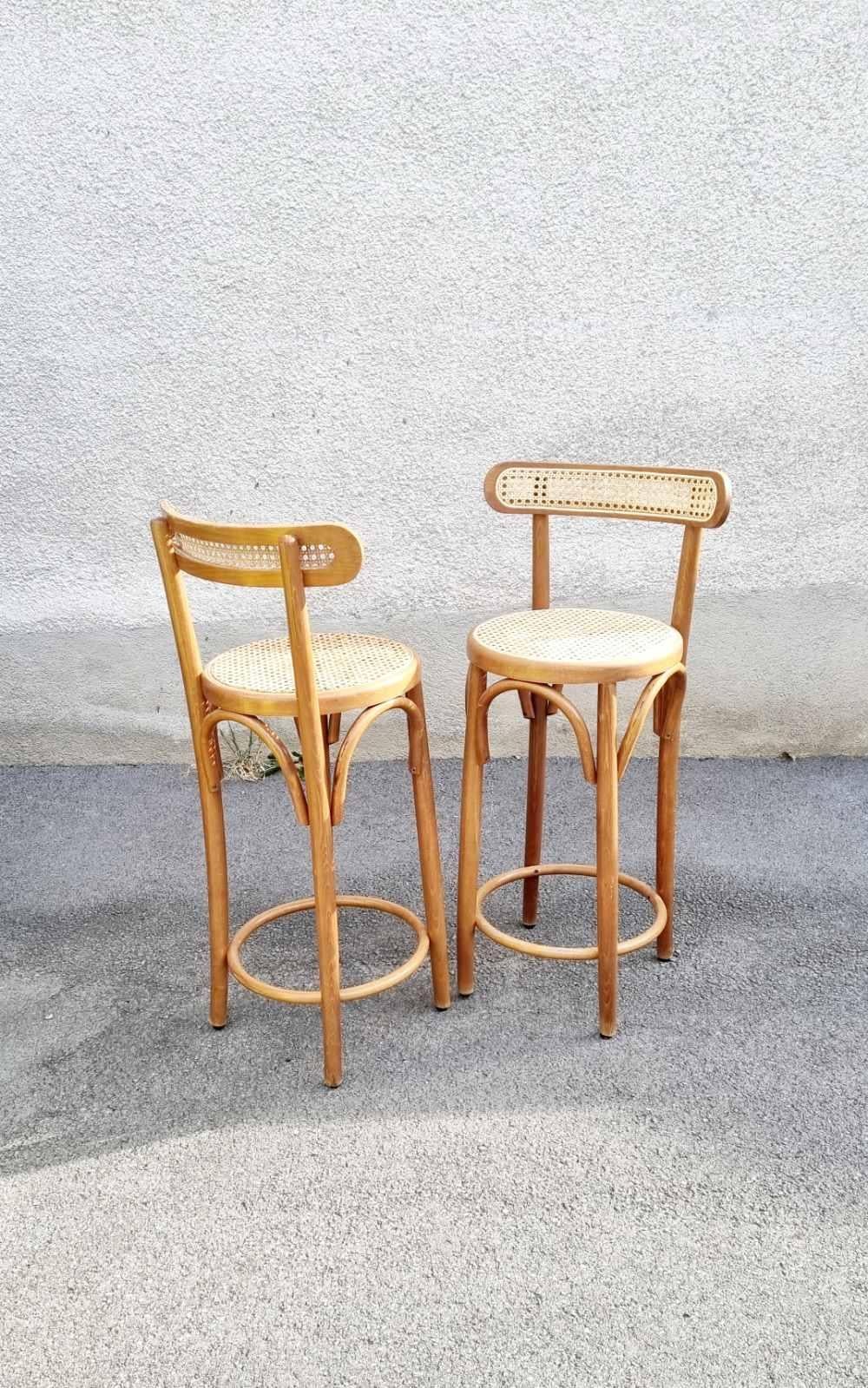 Thonet style Bar Chairs were made in Italy in '70s.
They are made of brown bentwood (beech wood) and beige wicker seats and backrests. One Chair has new wicker on the seat and backrest, the other has original ones.
Chairs are comfortable and perfect