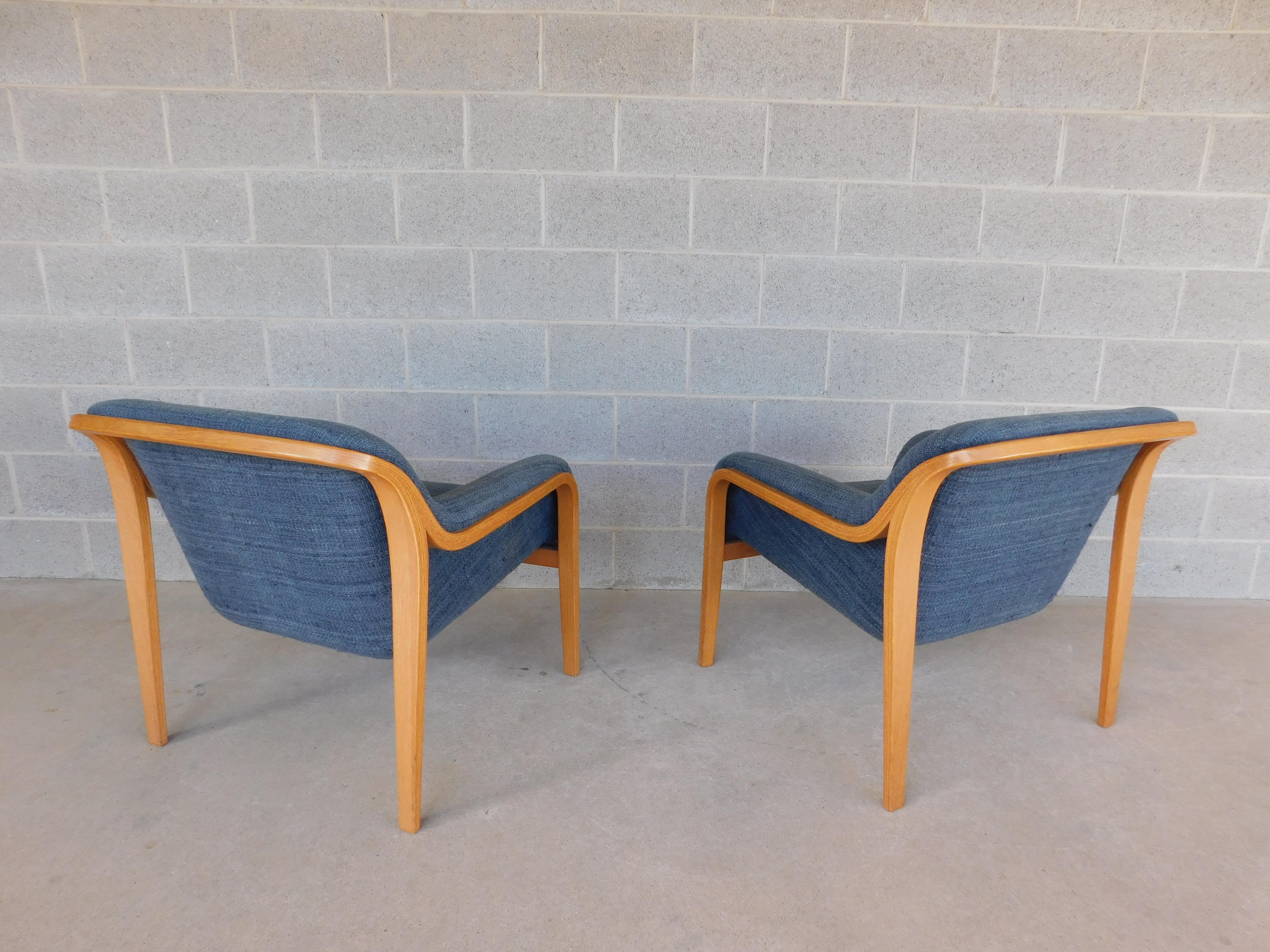 Bentwood lounge chairs. Covered in a vintage light / medium blue upholstery. Designed by Bill Stephens for Knoll. Features Original Upholstery with Clasp Retainers, Shows Wear to the Upholstery Cushion Bottoms and Under Arm Lower Sides Cushion