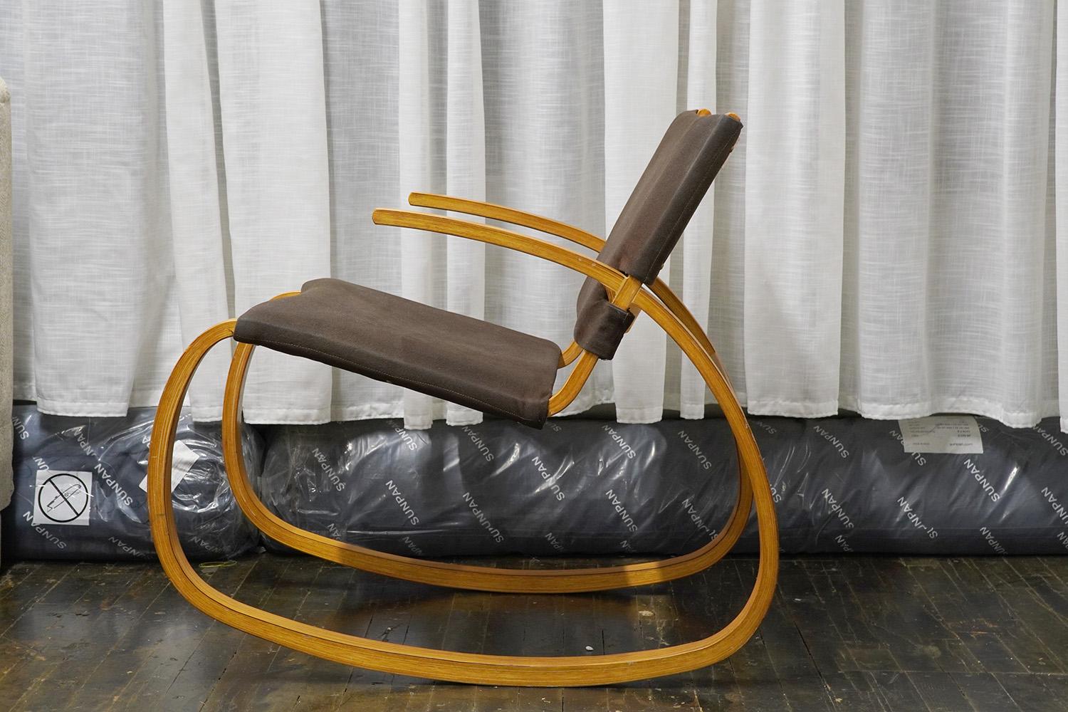 A Plycraft bentwood rocking chair, circa 1970. The frame is in original condition - showing some minor scuffs (see close up images).

Original brown fabric upholstery. Surprisingly comfortable chair. Ready for use.

Plycraft was a mid-century