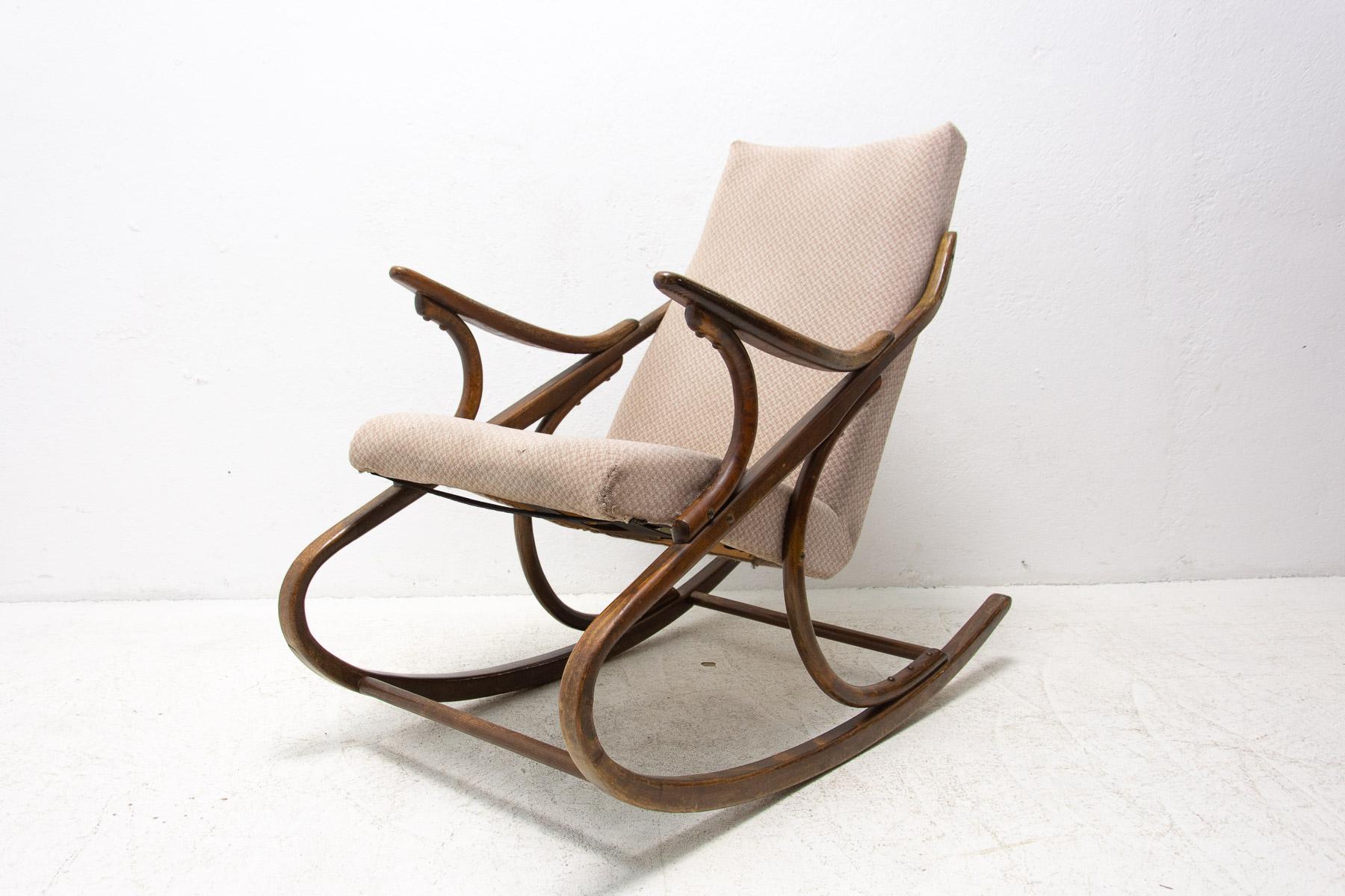 This upholstered bentwood rocking chair was made by TON company in Czechoslovakia in the former Czechoslovakia in the 1960’s. In good preserved Vintage condition, the upholstery shows signs of age and using.

Measures: Height: 87 cm

width: 55