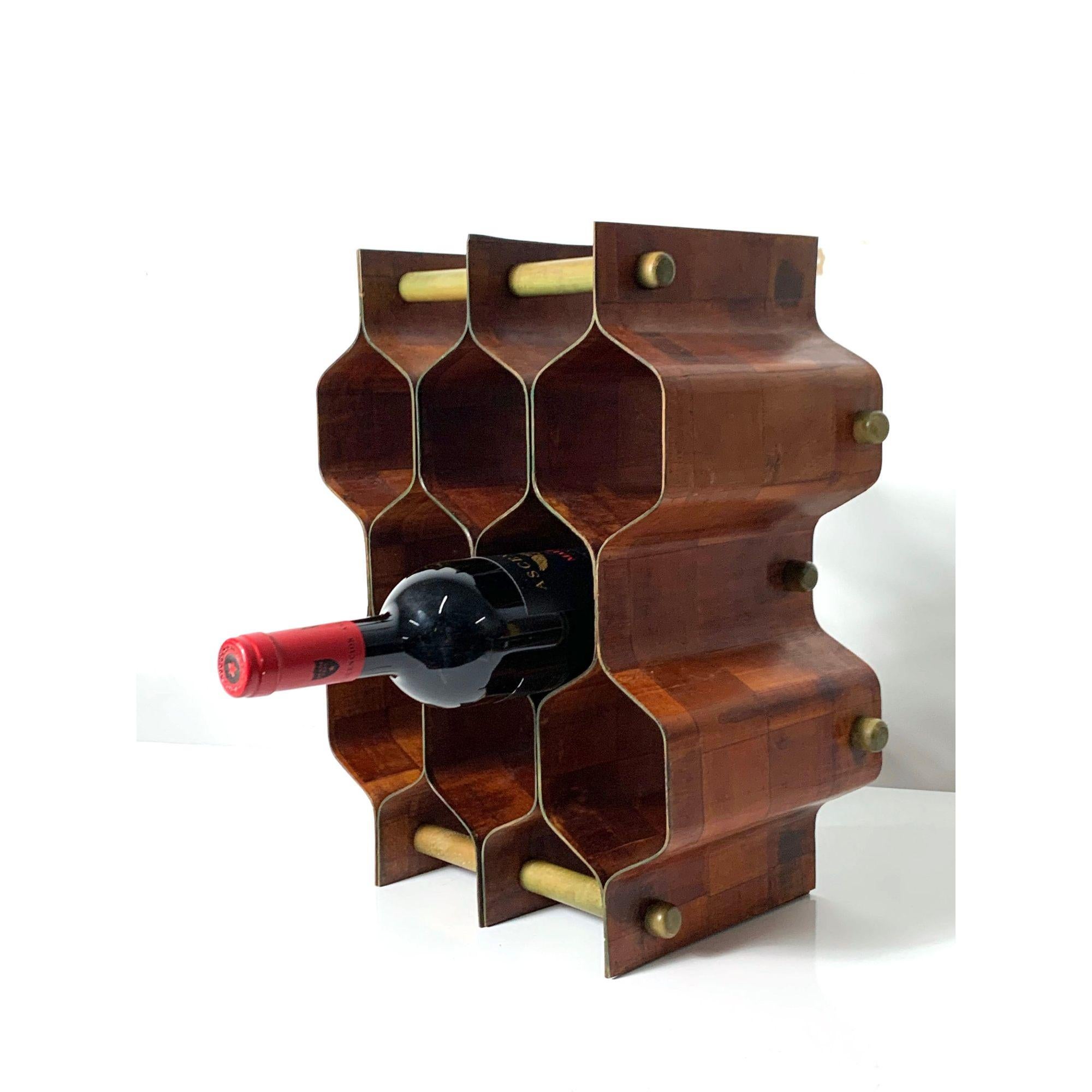 Mid Century Wine Rack by Torsten Johansson 1960s

Sculptural wine rack designed by Torsten Johansson for AB Formtra, Sweden 1960's.
Bentwood construction with mixed wood parquet pattern, can be placed horizontally or vertically.

Additional