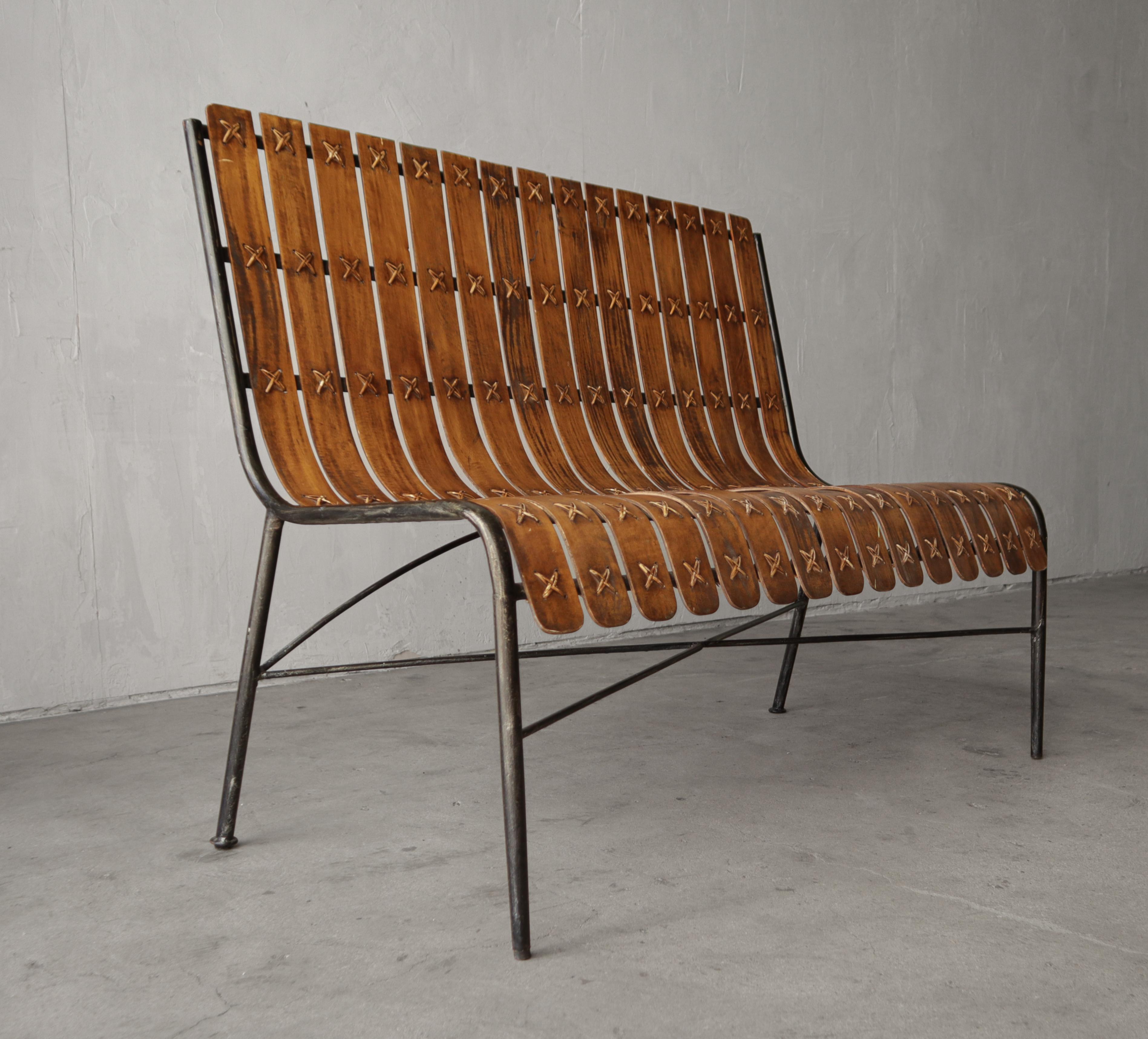 Love this unique Mid Century bentwood slat bench.  The curve of the seat and the rattan X details are everything.  A truly unique piece.  Can only find one other example, a lounge chair.  Love it's unique style and rarity.

Bench is in overall great