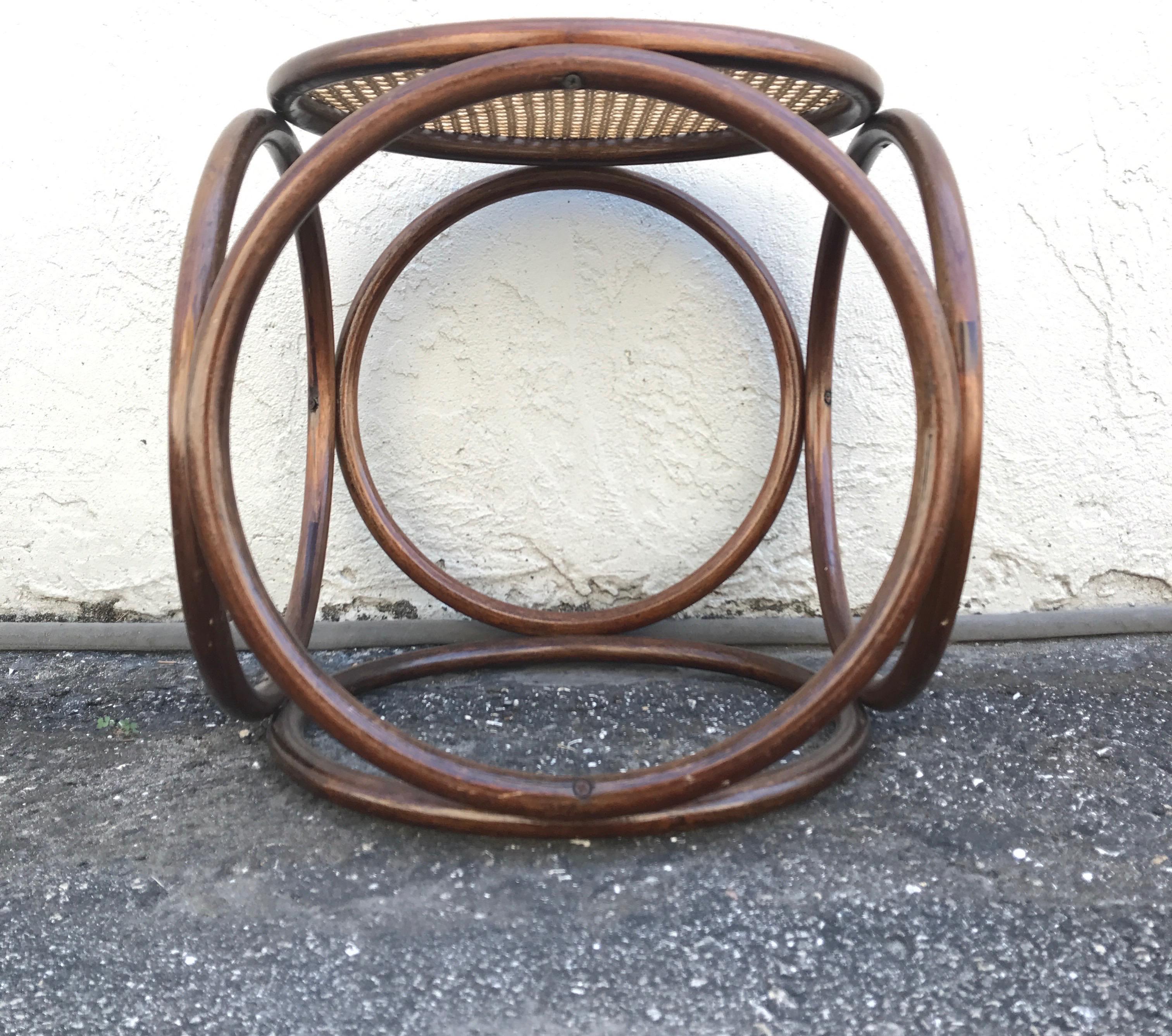 Cane top bentwood stool in the shape of a cube designed by Michael Thonet.
