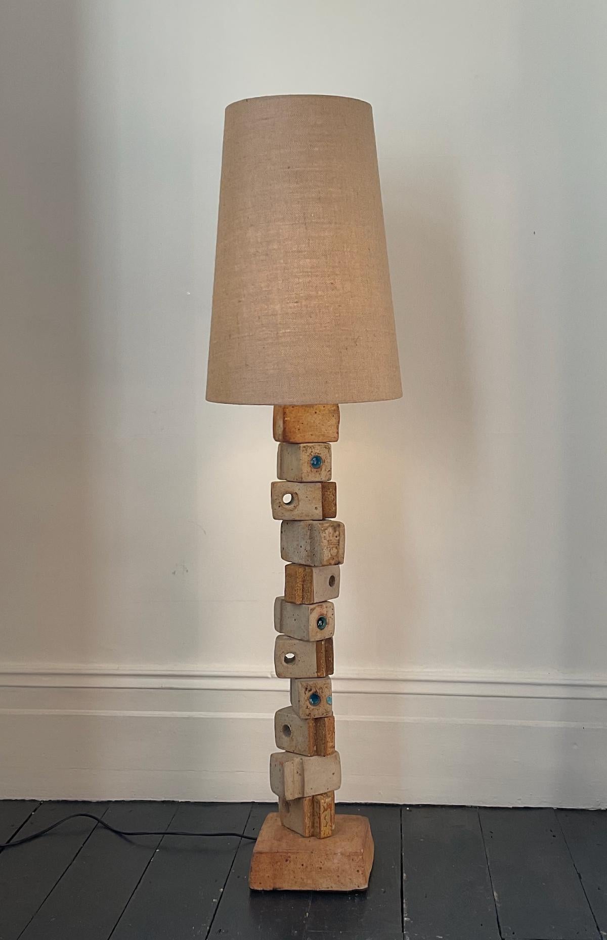 A monumental ceramic TOTEM lamp by Bernard Rooke, mid-20th century England.

A beautiful sculptural piece, made up of ceramic elements in natural tones of terracotta and stone. A very unusual model with rectangular blocks - some pierced, others