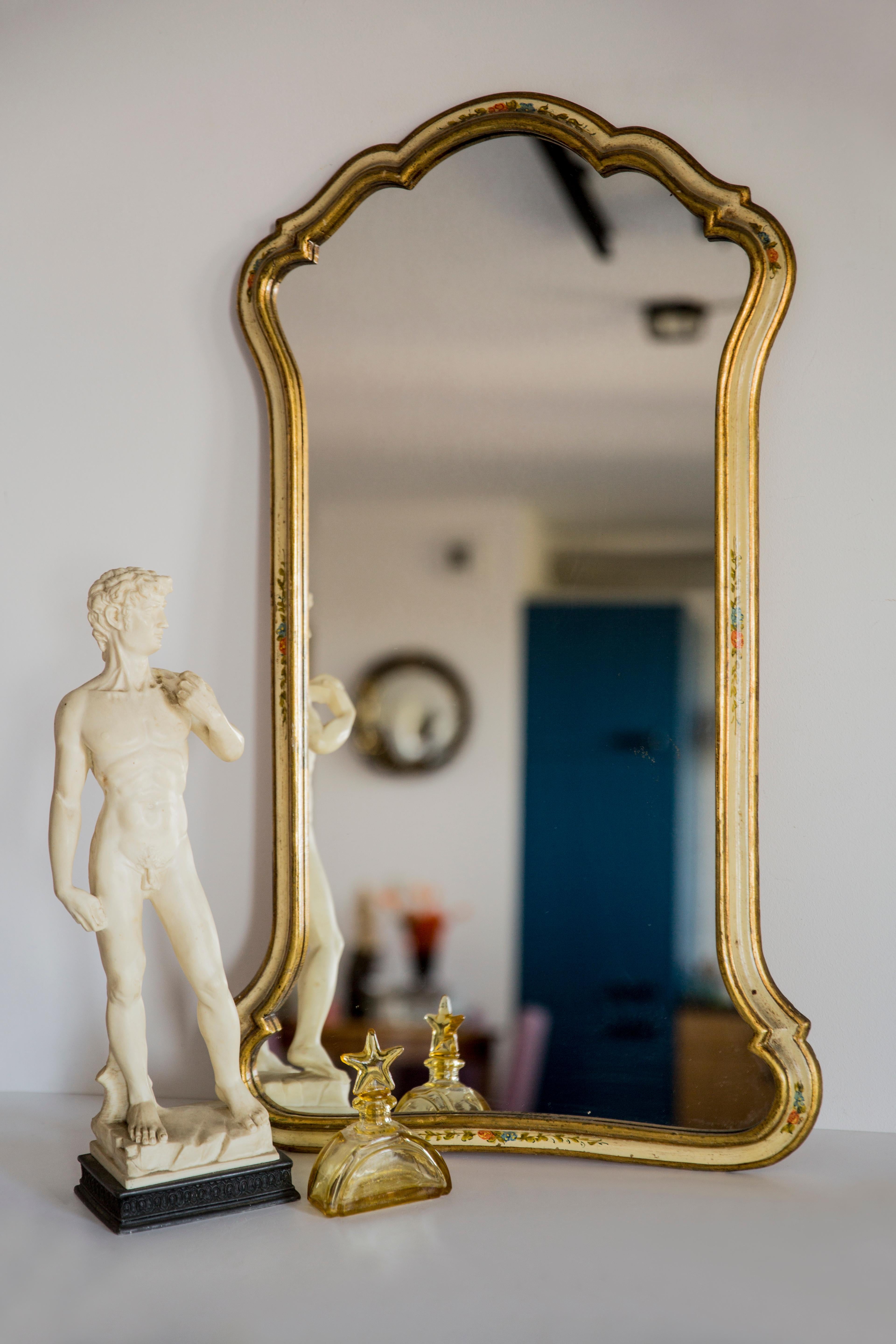 Beautiful mirror in a decorative frame from Italy. The frame is made of wood. Mirror is in very good vintage condition. Original glass. Amazing patina. Beautiful piece for every interior! Only one unique piece.