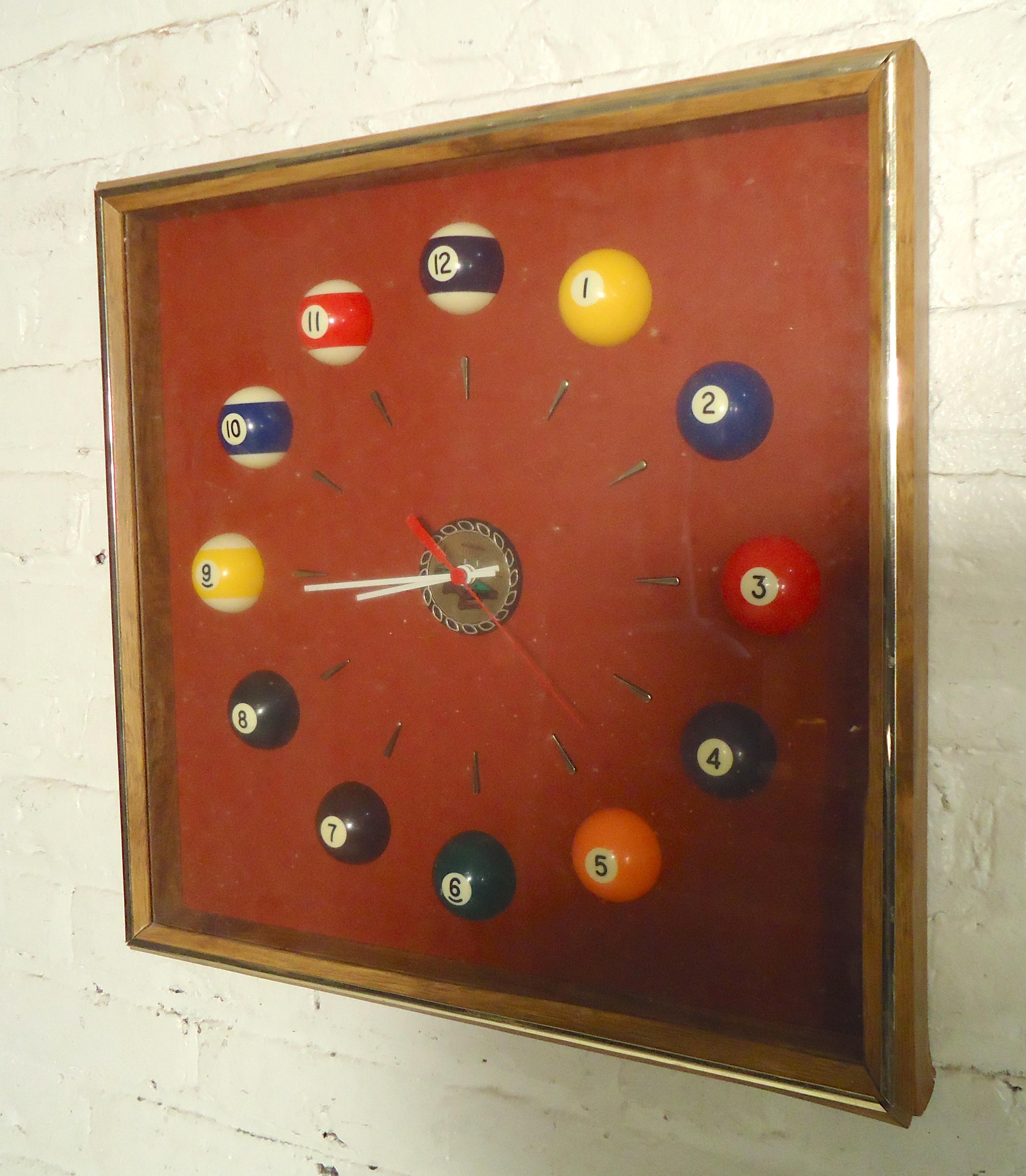 Fun pool hall clock with billiard balls as the hours.

(Please confirm item location - NY or NJ - with dealer).
 