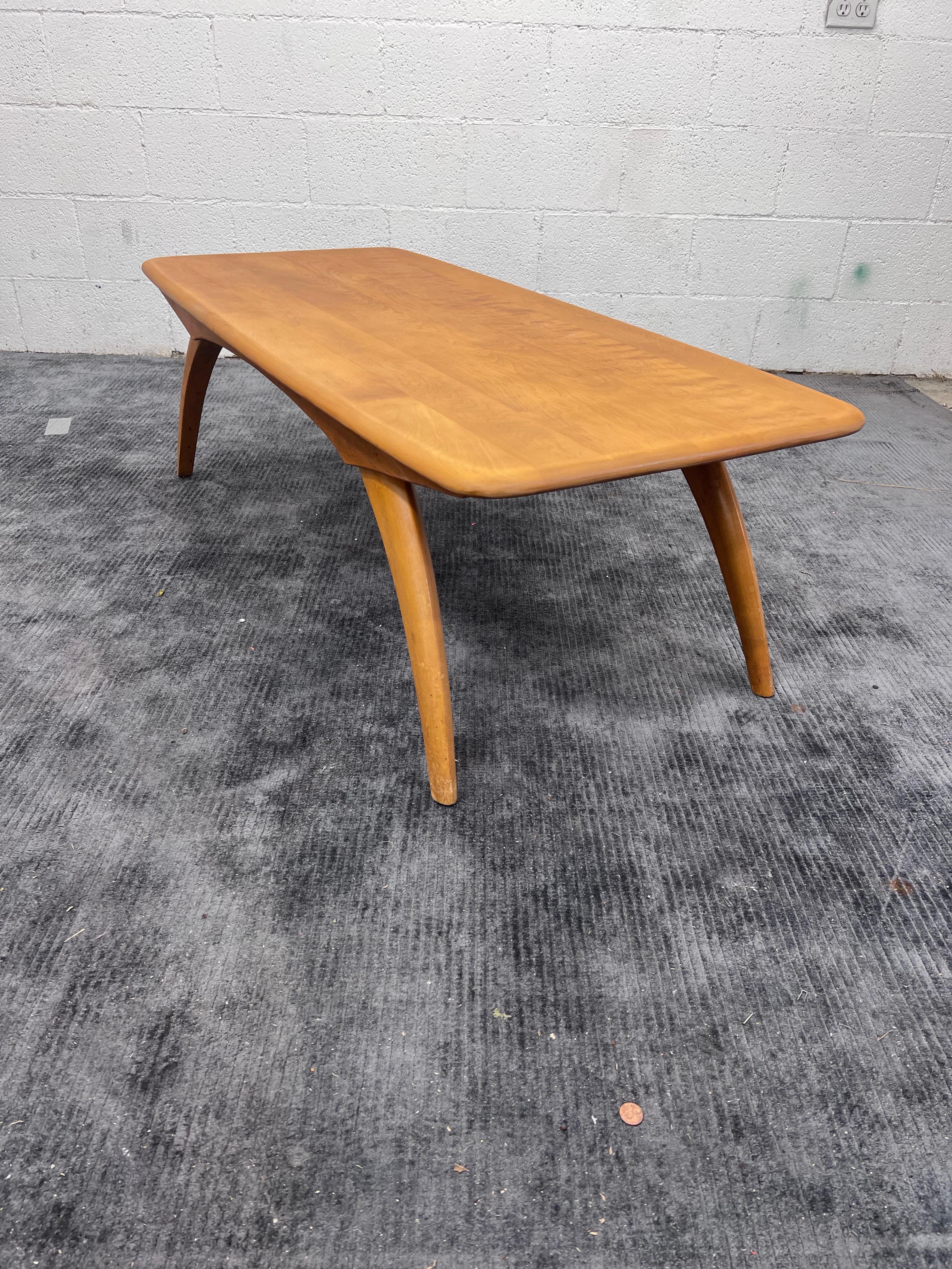 Manufactured 1953-1955 only. This table is made in Solid birch with arched wishbone legs.