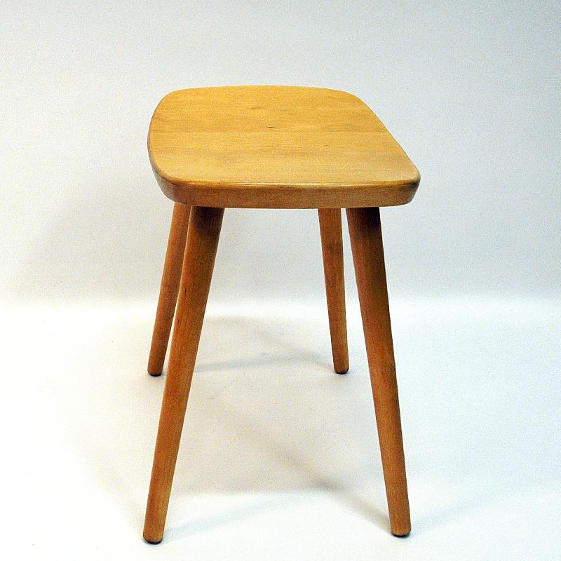 Stylish and solid vintage birch stool Palle by Yngve Ekström for Stolab, Sweden, 1950s. Perfect as an extra seat around the table or as a small table or foot rest. Great design and good vintage condition. 
Measures: 44 cm H x 45 cm W x 32 cm D.