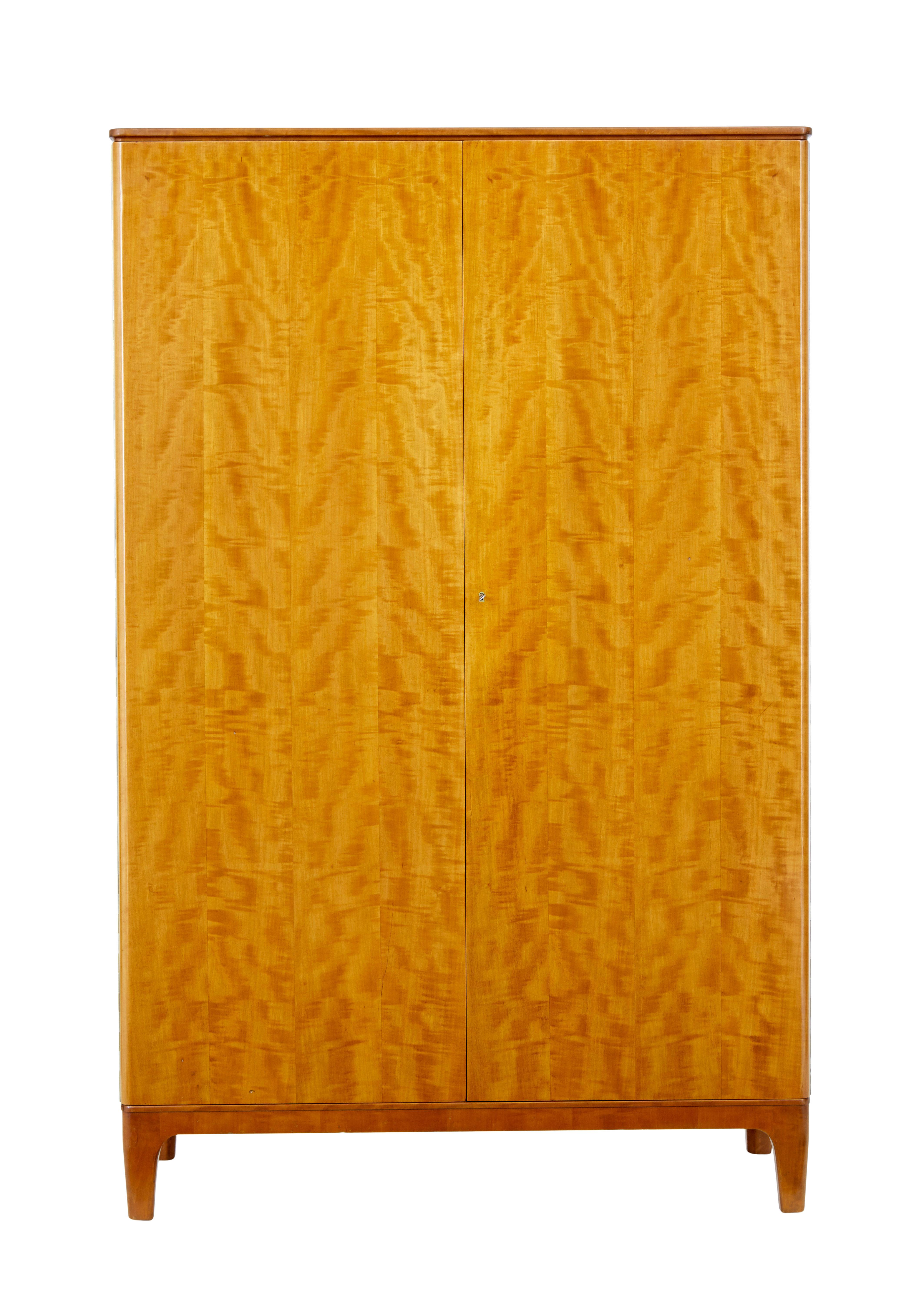 Mid century birch wardrobe by Oscar Nilsson for Nordiska Kompaniet circa 1939.

We are pleased to offer this fitted wardrobe which is an early piece in the scandinavian modern furniture movement.  Designed by oscar nilsson (1895-1975)  this piece is