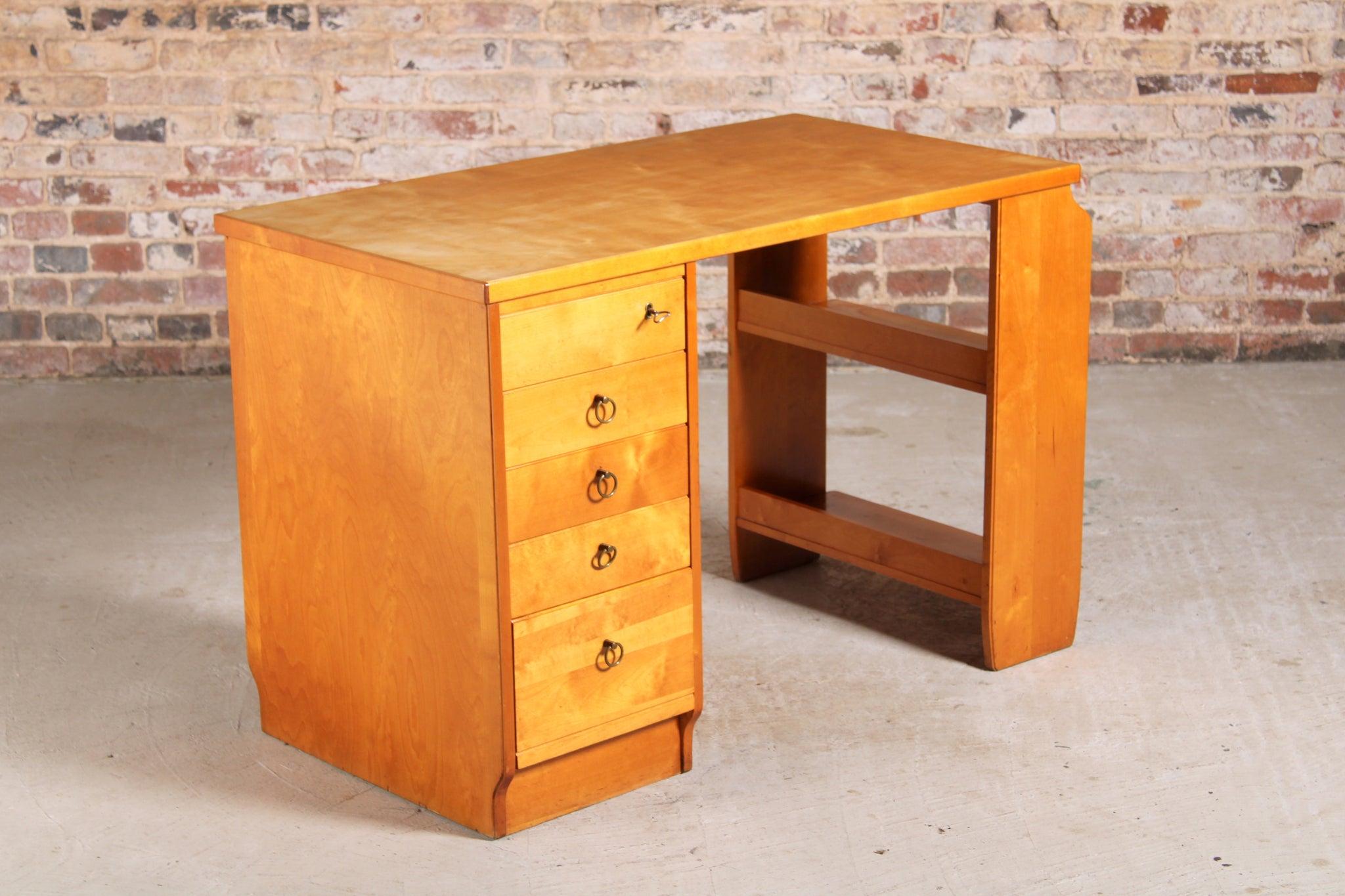 Mid-century birch writing desk with shelves by Ilmari Tapiovaara, Finland, circa 1950s. Lockable top drawer and 4 other drawers with brass handles.

Dimension: W 116cm x D 60cm x H 75cm