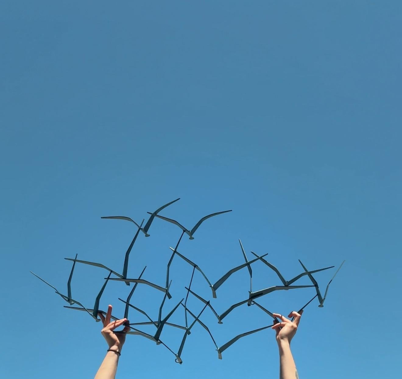 Mid-century Birds in Flight wall sculpture by Curtis Jere (C. Jere). This version is in a dark blue coloration. The Curtis Jere 