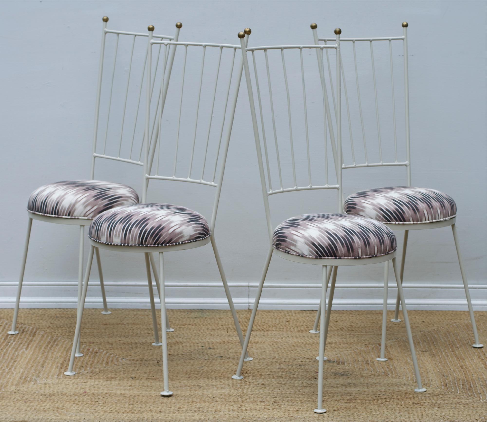 Set of four Mid-Century Modern metal bistro chairs finished in a light dove grey lacquer with ikat seats adorned in a captivity ikat linen by Chris Farr Cloth. The metal fabricated chairs are breakfast room or game table setup ready with lots of