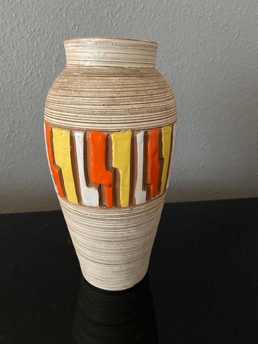 Nice Bitossi vase with vibrant colors. 
The Bitossi family was documented in the territory of Montelupo Fiorentino as far back as 1536. Over the centuries they have been kiln workers, sculptors, painters, but especially potters in this area with