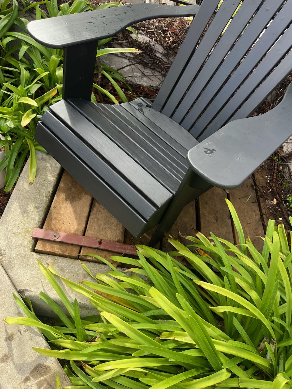 Pair of Mid Century wooden Adirondack outdoor chairs. 
Wonderful size and comfortable to sit on. 
Great for a cabin or beach house. 