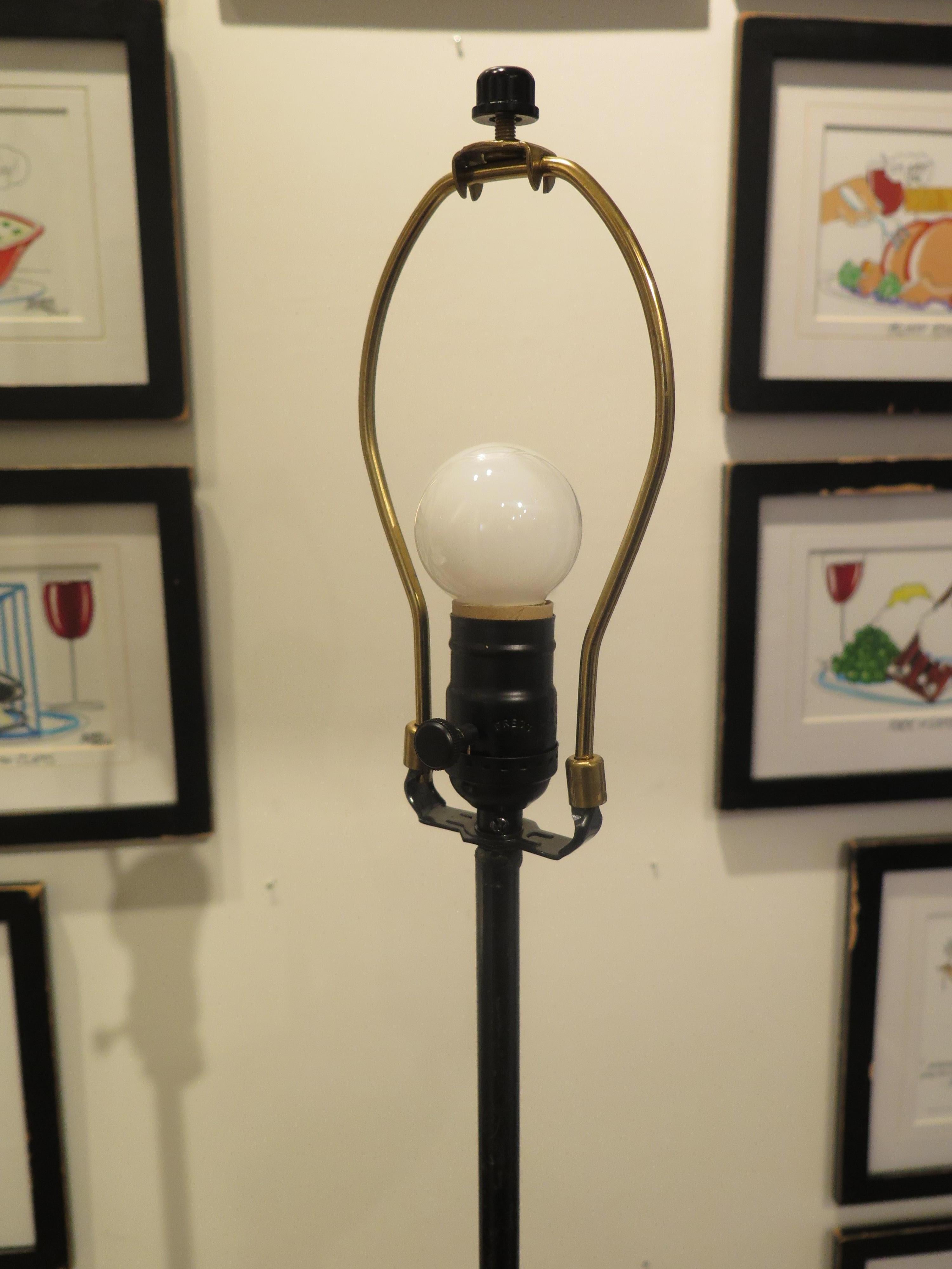 Midcentury black and gold torchiere already wired and ready for use. Floor lamp measures 49.5