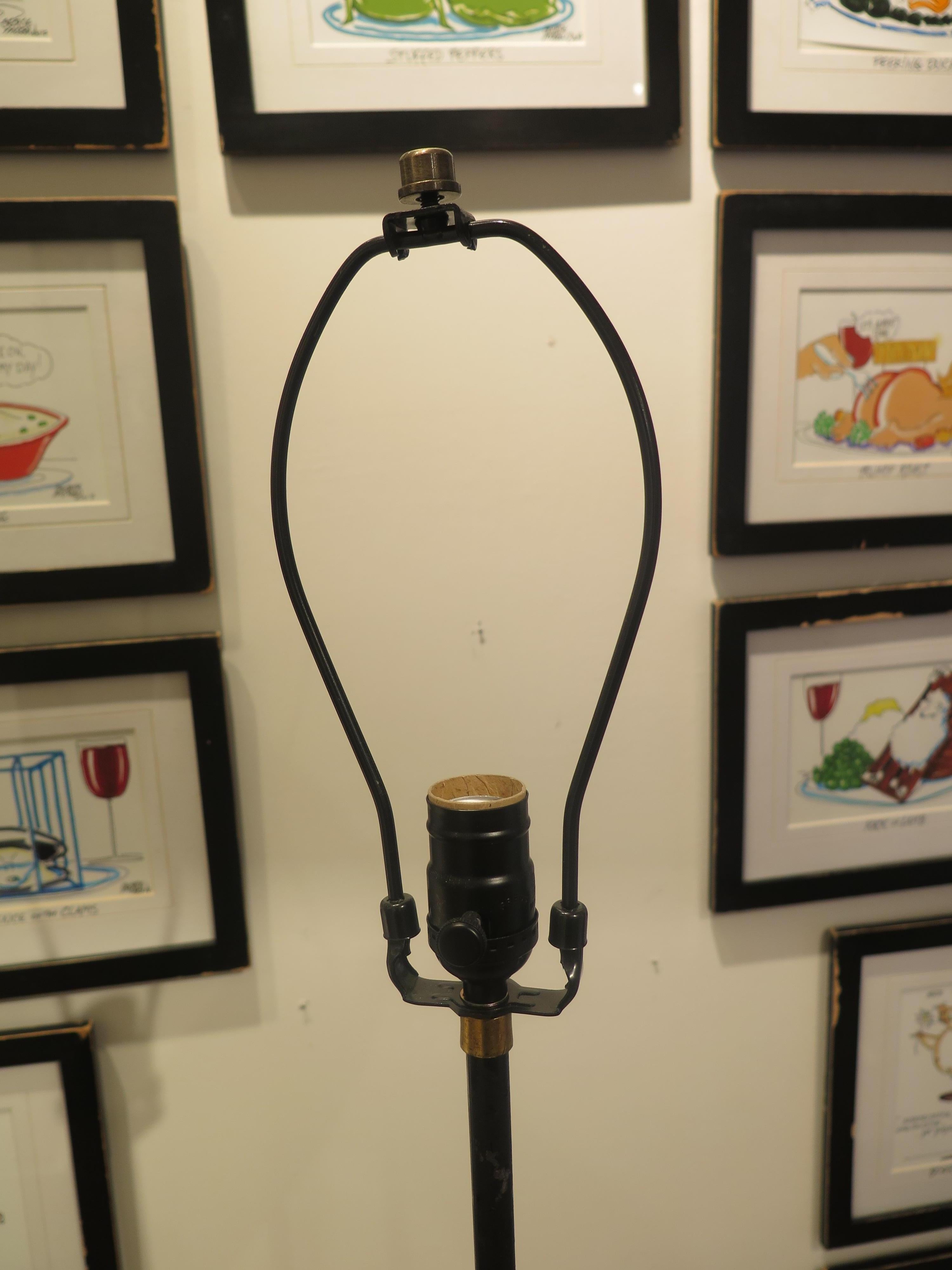 Midcentury black and gold torchiere already wired and ready for use. Floor lamp measures 58