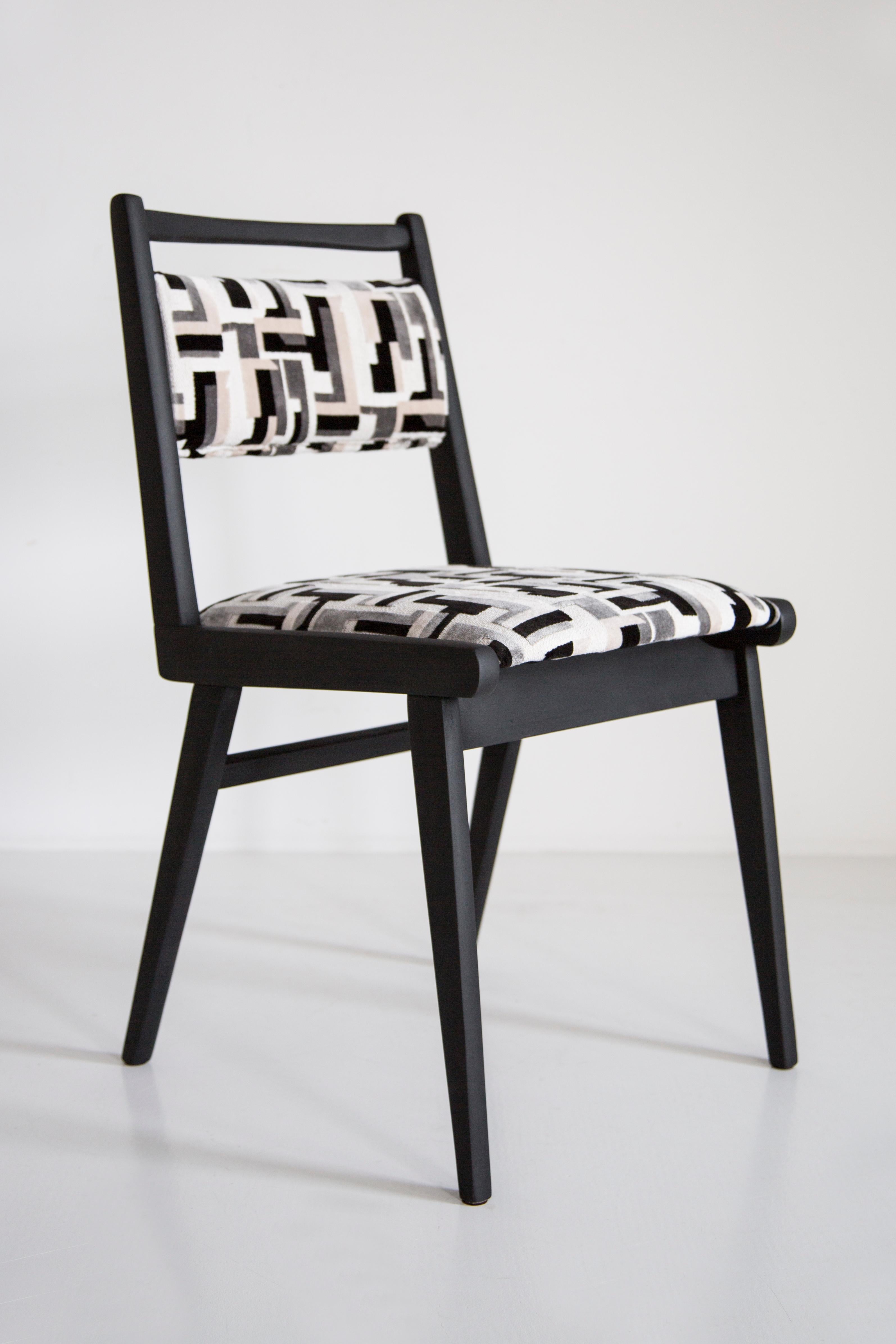 Chairs designed in 1960s by Prof. Rajmund Halas. It is jar type model. 
Made of beechwood. Chairs are after a complete upholstery renovation, the woodwork has been refreshed and painted in matte black. Seat and back is dressed in a black and white