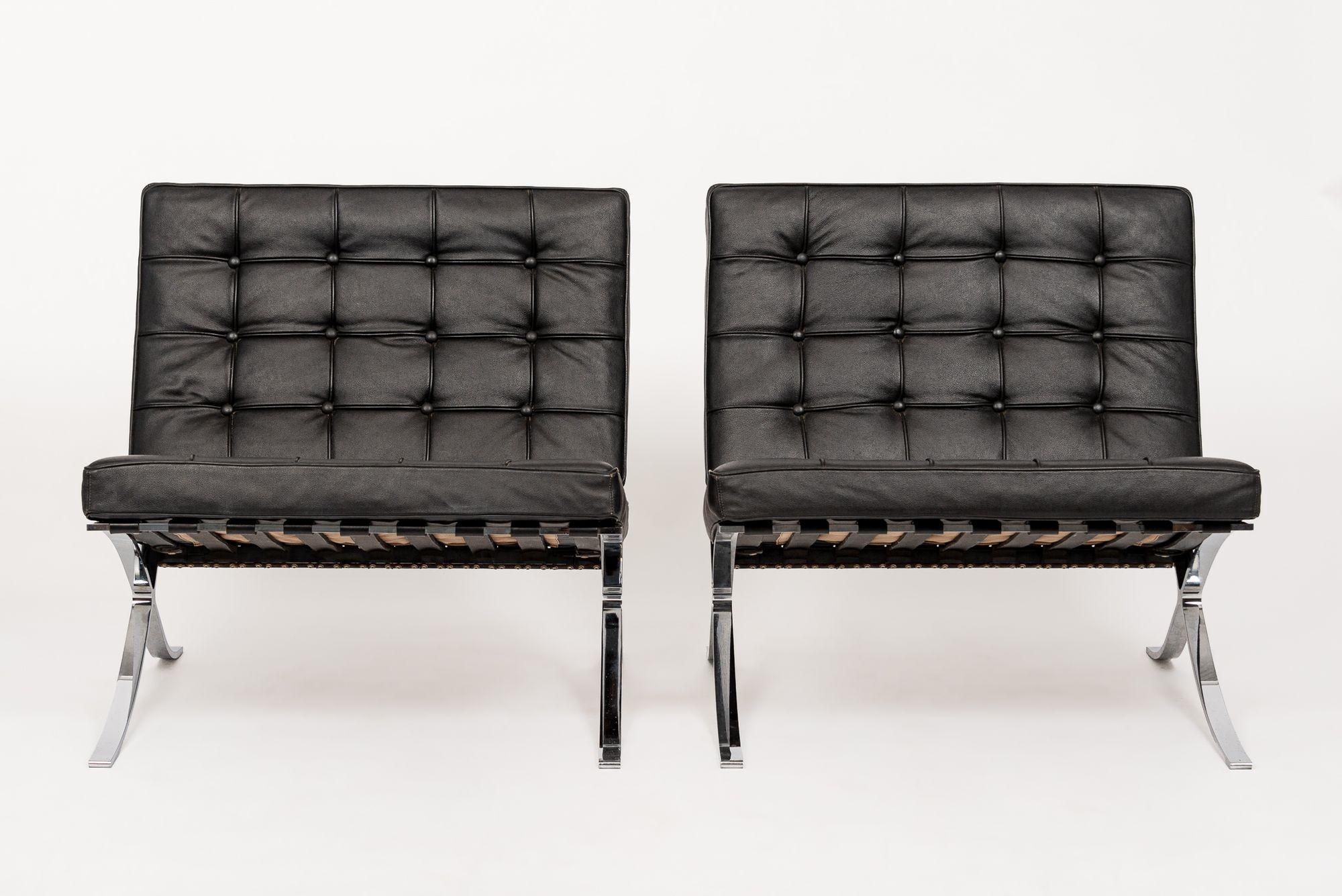 This pair of vintage mid century modern black Barcelona chairs designed by Mies van der Rohe for Knoll (attr.) are circa early 1990s. This iconic Bauhaus chair originally designed by Ludwig Mies van der Rohe and Lilly Reich in 1929 for the Barcelona