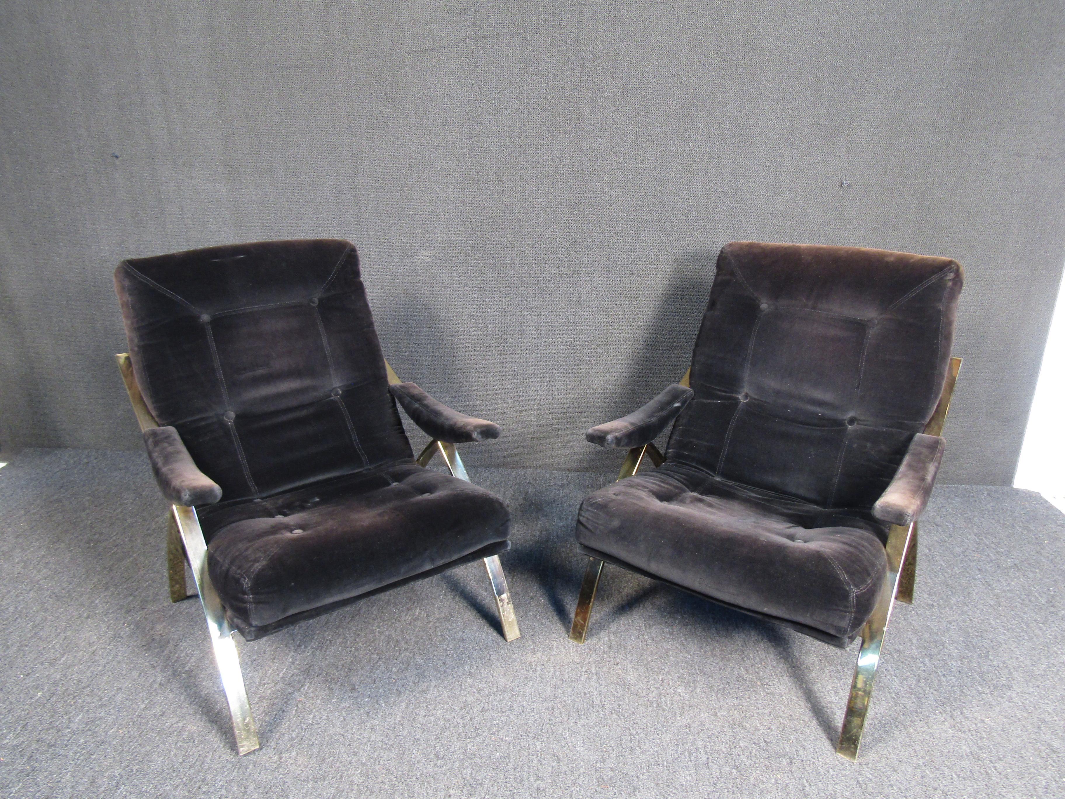 Comfortable mid-century modern black fabric lounge chairs with brass crossed legs. 

(Please confirm item location - NY or NJ - with dealer).
 