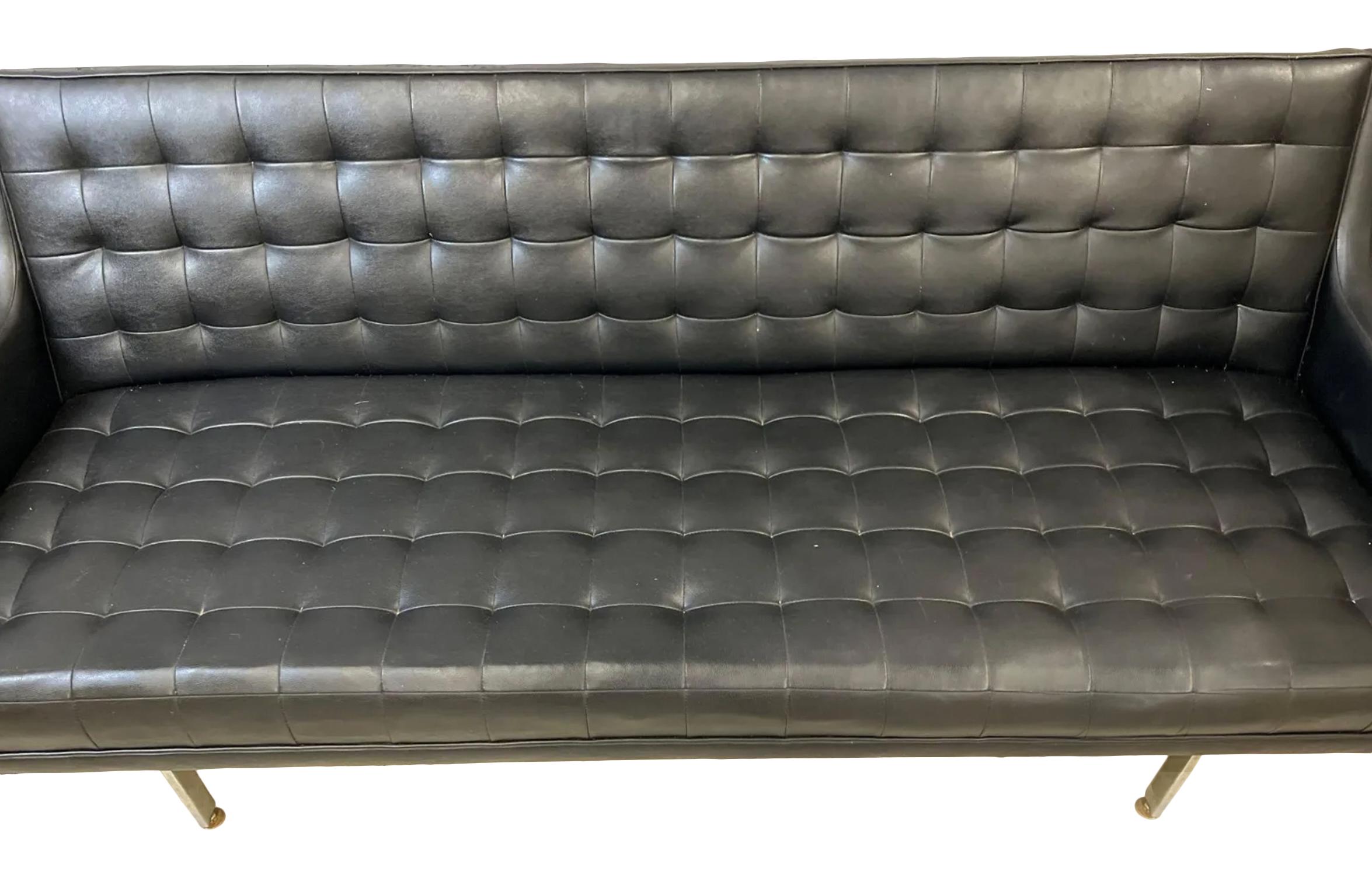 Beautiful Unique Mid-Century Modern black faux leather vinyl tufted sofa with a Chrome base and soft Black Vinyl by Patrician. Very soft black Vinyl faux leather on chrome frame and simple structure. Low seating 17