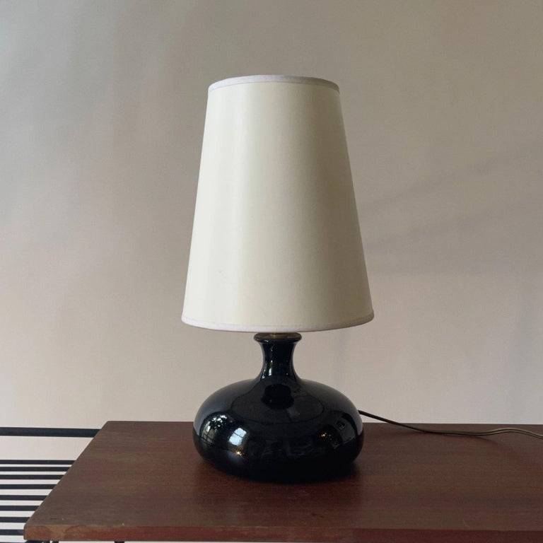 Mid century black glazed French Art pottery lamp.

A charming example of French art pottery made as a lamp, probably 1960s. Earthenware with a black glaze. Signed.

Dimensions: 29 x 13 cm
Excellent condition.
