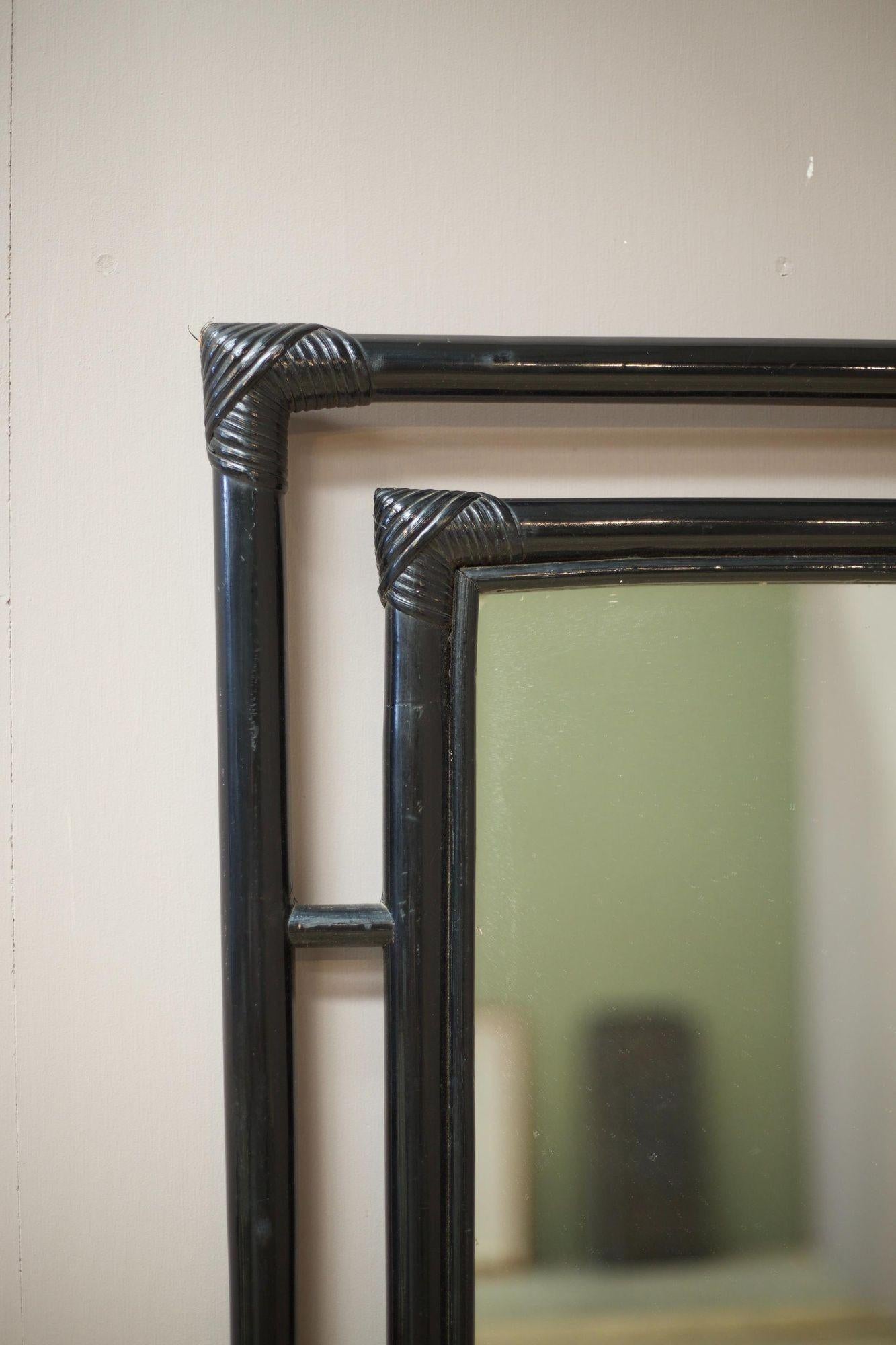 This is a nice quality midcentury Black lacquer bamboo mirror. In clean original condition with a large mirror plate. Making this a hugely decorative addition to a room. The frame is all bamboo which has been lacquered in black giving it a Classic