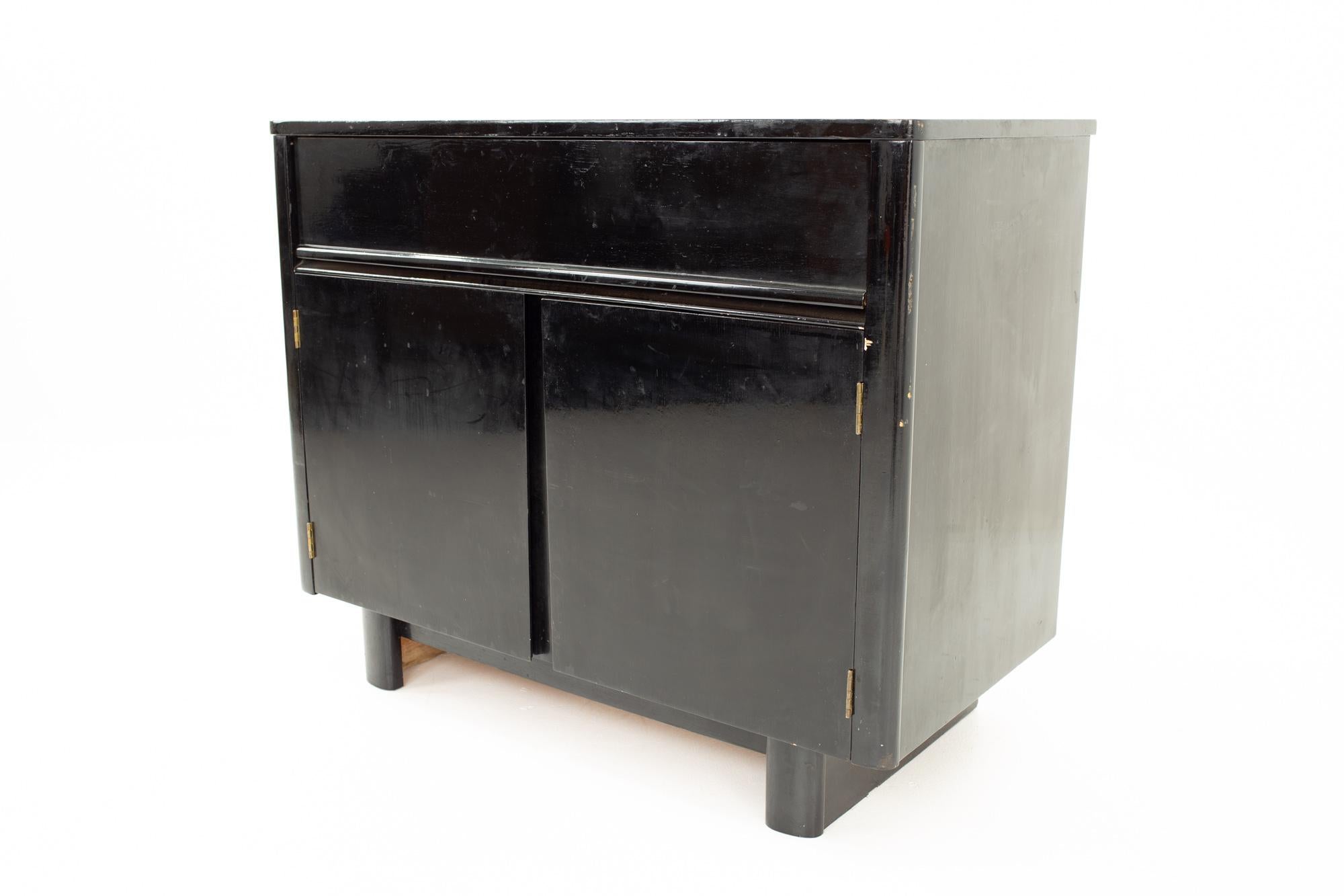 Mid century black lacquer cabinet
Cabinet measures: 38.5 wide x 19 deep x 31 high

All pieces of furniture can be had in what we call restored vintage condition. That means the piece is restored upon purchase so it’s free of watermarks, chips or