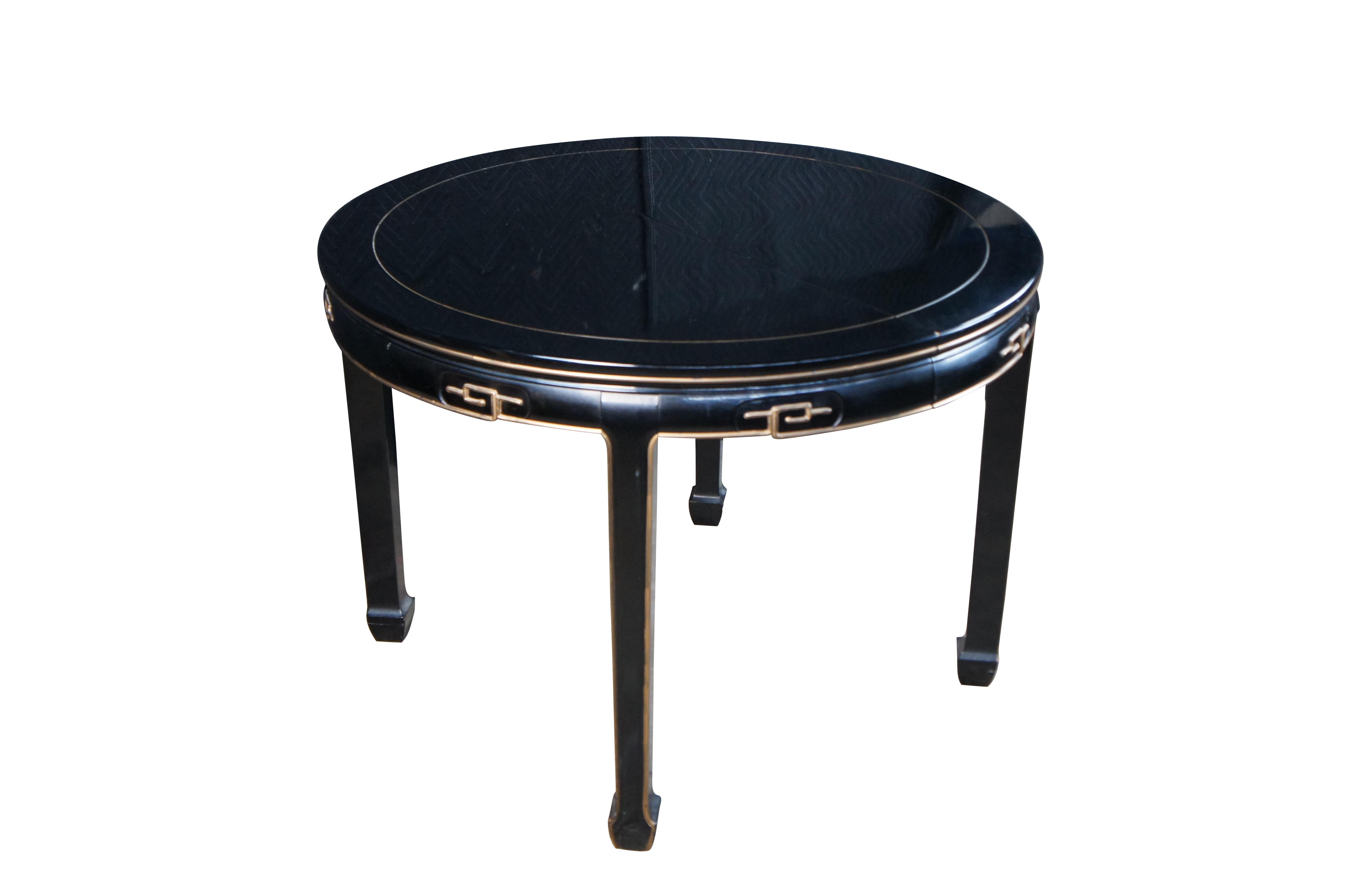 Mid century black lacquered breakfast / dining table featuring round form with gold accents and ming style legs..  Made in Taiwan, ROC Republic of China.

Dimensions:
42