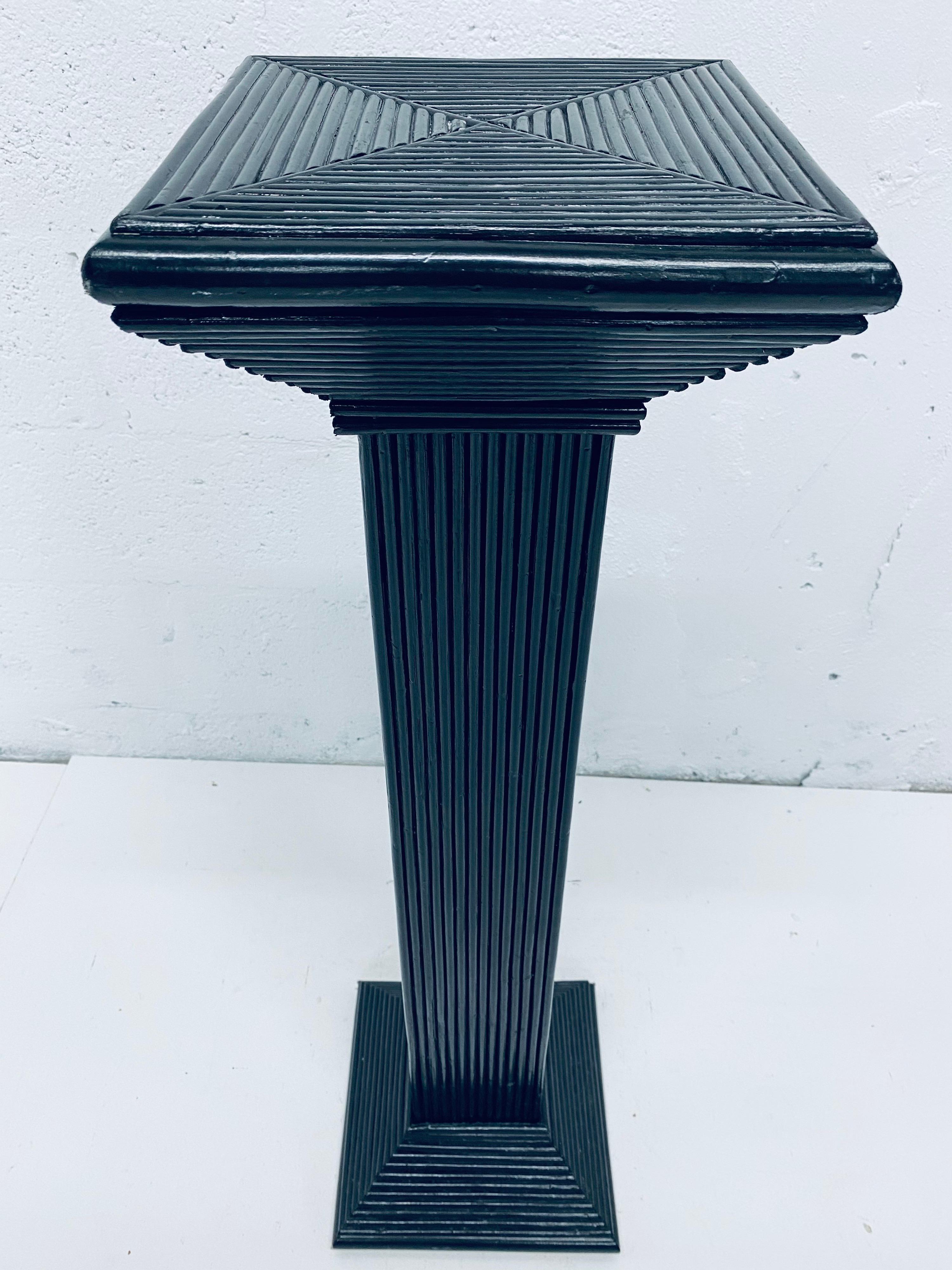 Black lacquered pencil reed rattan pedestal column table from the 1960s. 

Four pedestals available.

Surface dimensions: W9-1/2