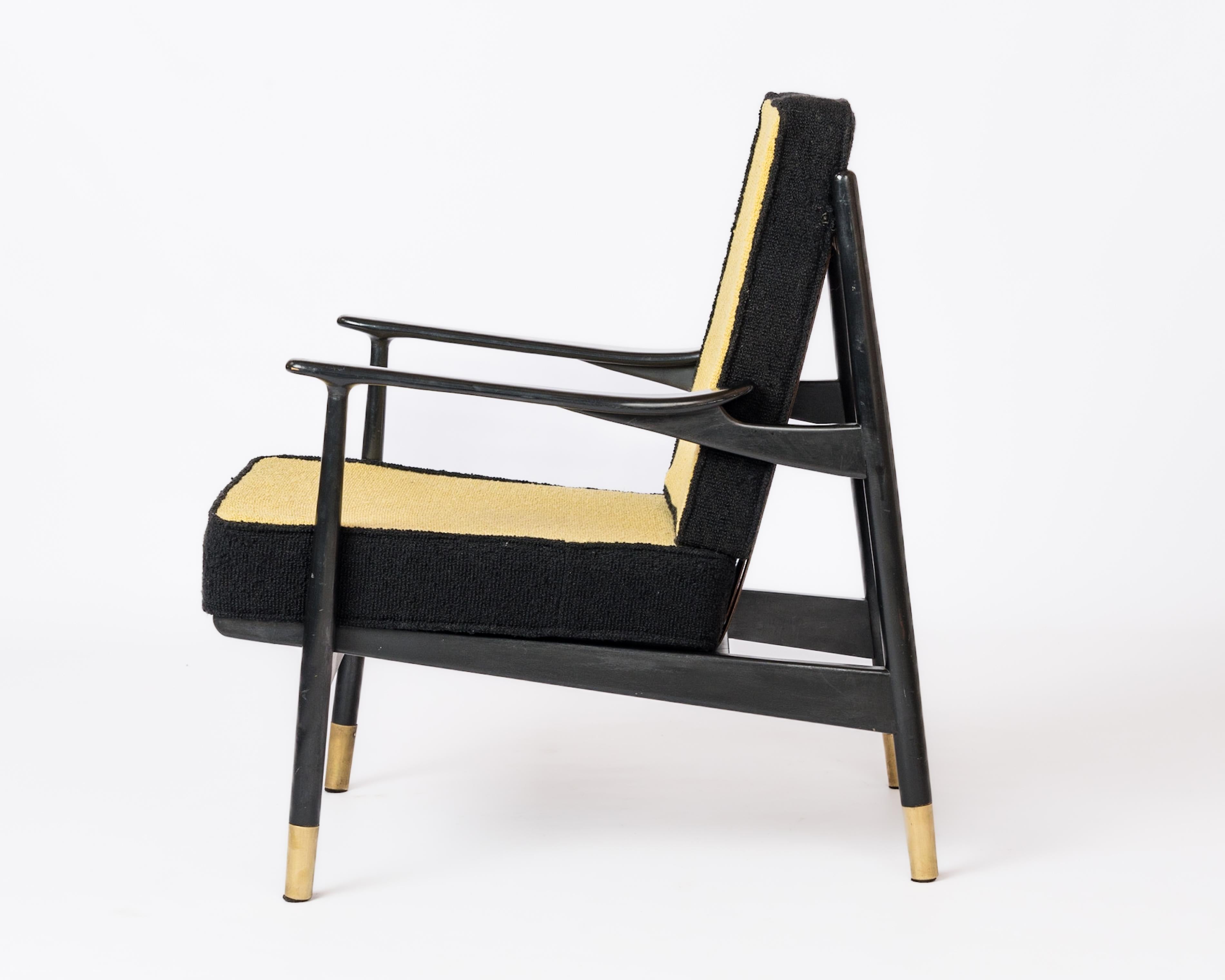 Unique black lacquered wood 1960's armchair in the style of Gio Ponti with brass feet and leather backrest straps.
Original two tone upholstery.
In fair vintage condition with some markings on armrests and some stains on leather straps.
This chair