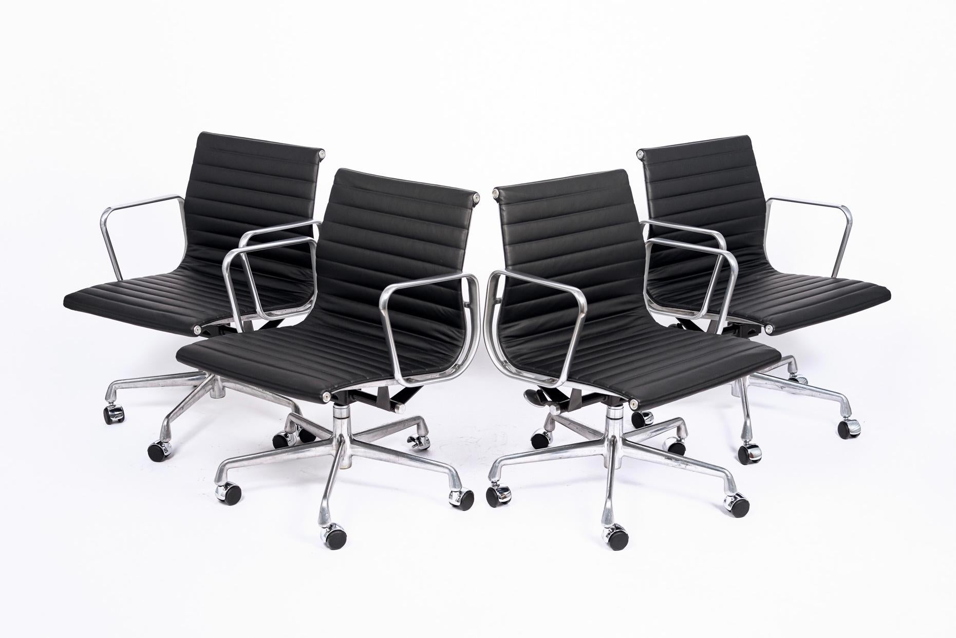 These Aluminum Group Management height office chairs designed by Charles & Ray Eames for Herman Miller are from the Eames Aluminum Group Collection. These distinctive chairs resulted from the Eames' experimentation with aluminum, which became more