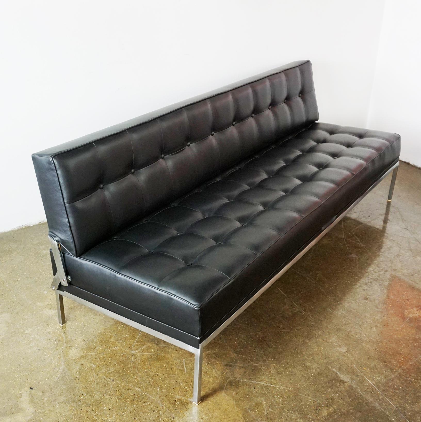 This Austrian Mid-Century Modern vintage sofa or daybed model Constanze with metal Base and renewed black Leather Upholstery was designed by Johannes Spalt 1961 for Wittmann, Etsdorf, Austria. 
It is very easy to handle by one hand to make the