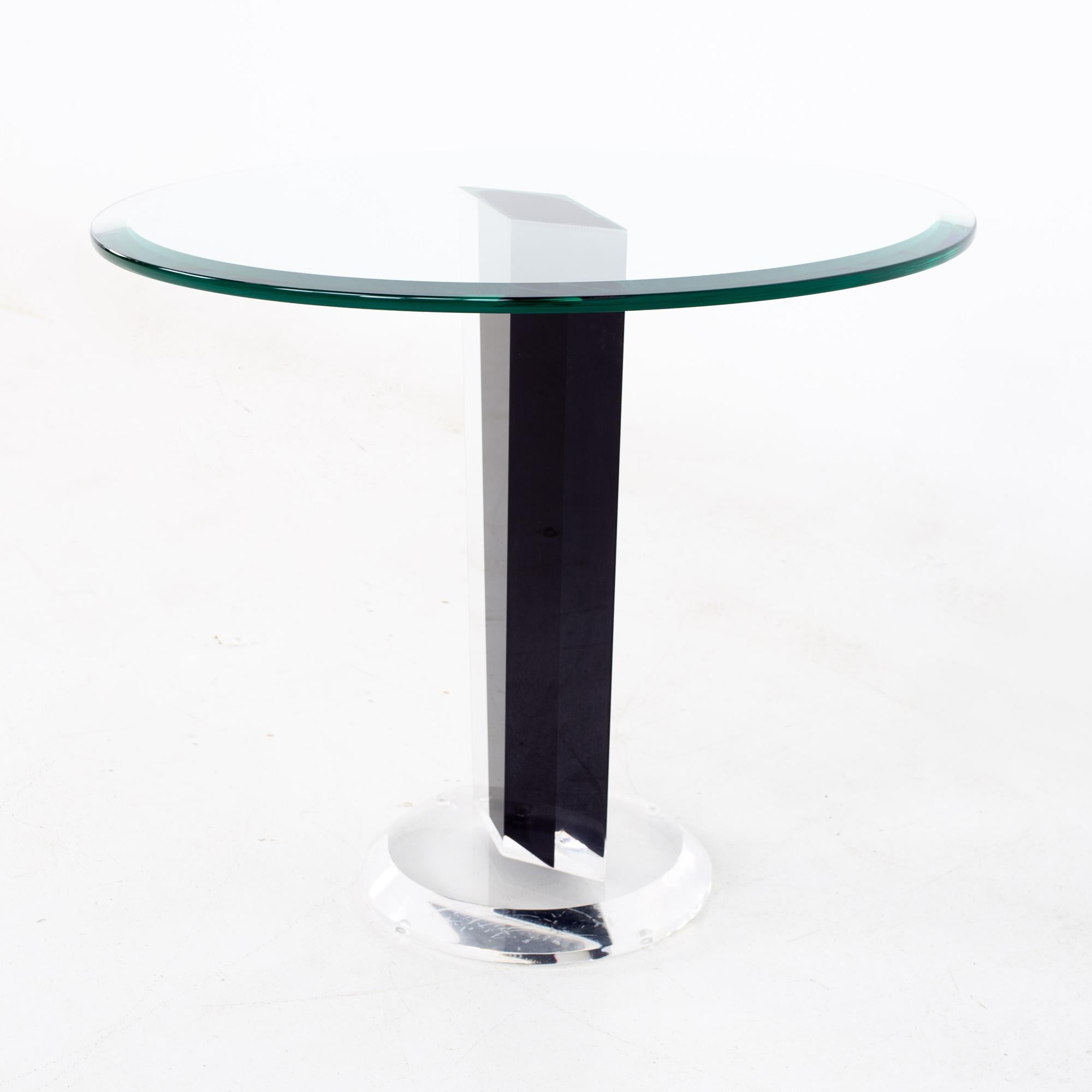 Mid Century black Lucite and glass round side end table
End table measures: 24 wide x 24 deep x 20.5 inches high

All pieces of furniture can be had in what we call restored vintage condition. That means the piece is restored upon purchase so