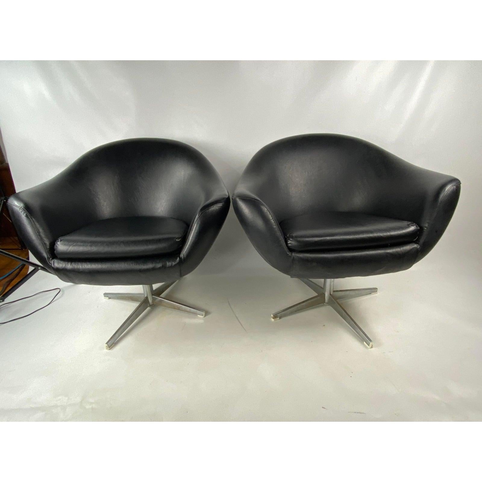 Great vintage pair of overman Swedish lounge chairs. Both match and swivel.