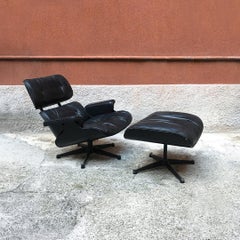 Midcentury Black Rosewood and Leather Lounge Chair and Ottoman by Eames, 1958