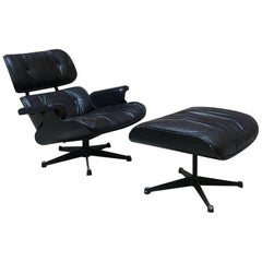 Midcentury Black Rosewood and Leather Lounge Chair and Ottoman by Eames, 1958