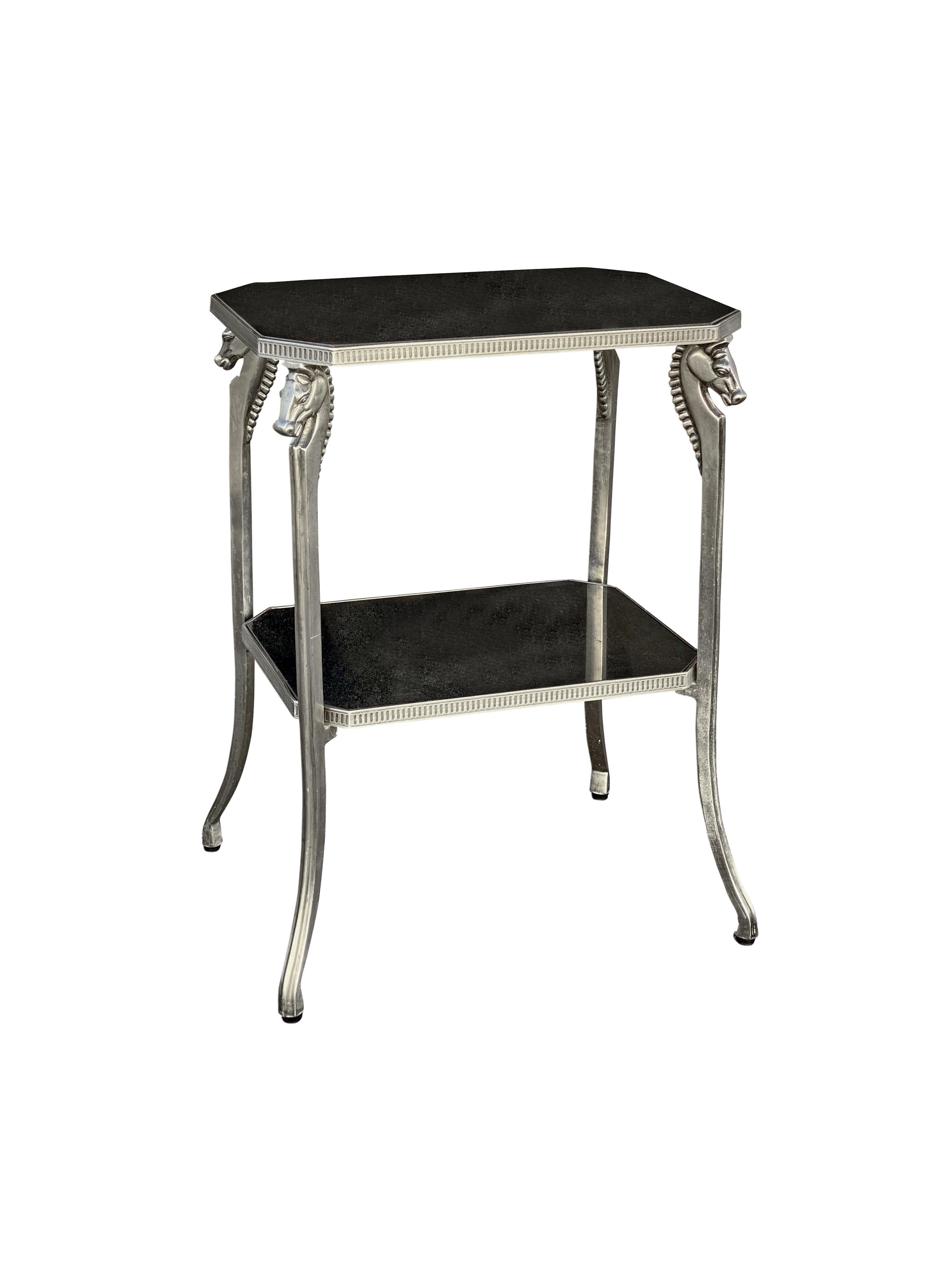 A unique side table featuring four horses (or seahorses), steel in a brushed nickel finish, with black stone granite tops on both shelves. Table is in wonderful condition. Black tops come out in case you want to swap out for mirror or glass.