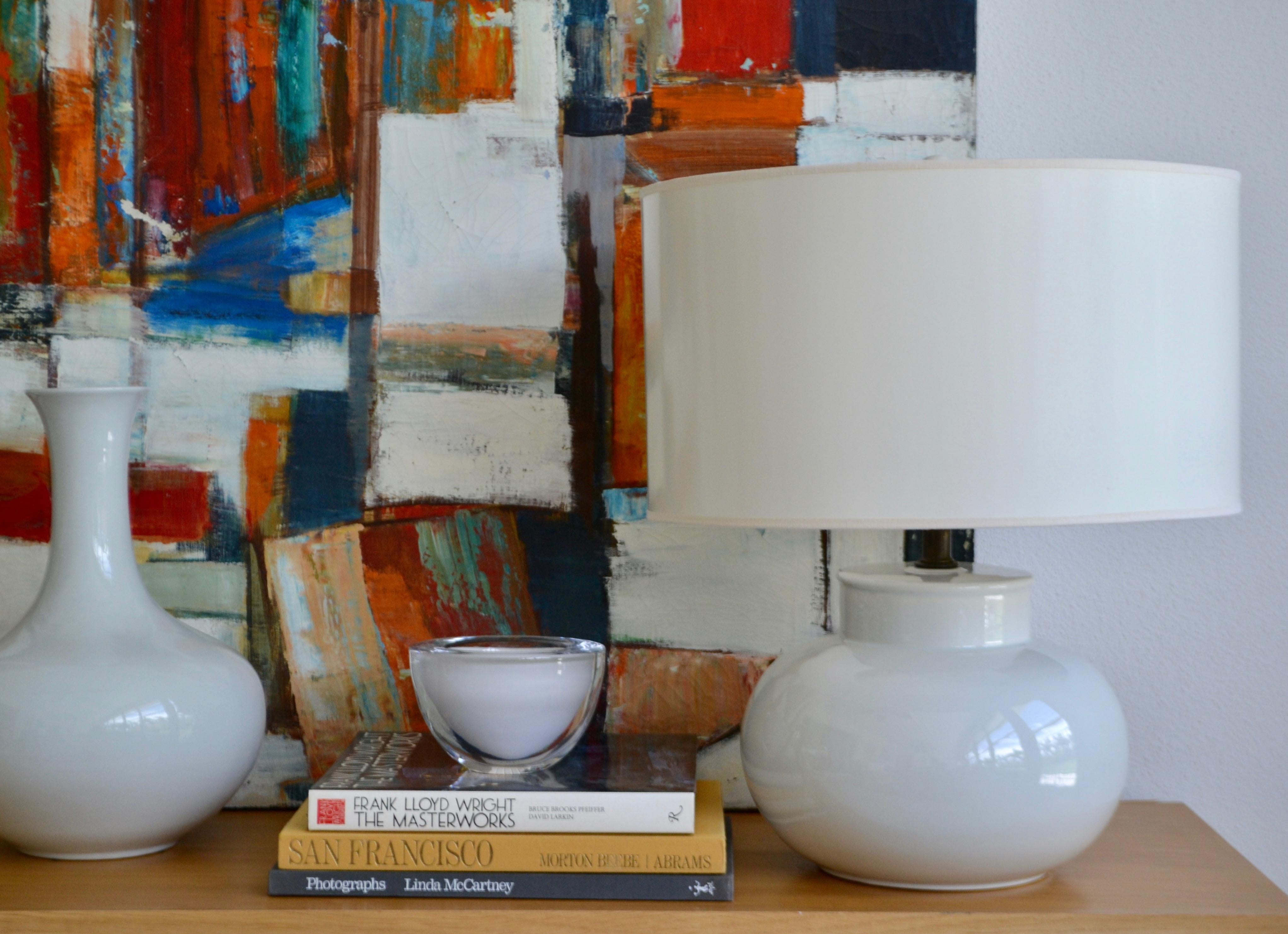 Striking Mid-Century Blanc de Chine ceramic gourd form table lamp, circa 1960s. This sleek hand thrown white glazed lamp is designed in the Minimalist fashion and wired with brass fittings.
Shade not included.
Measurements:
Overall: 22
