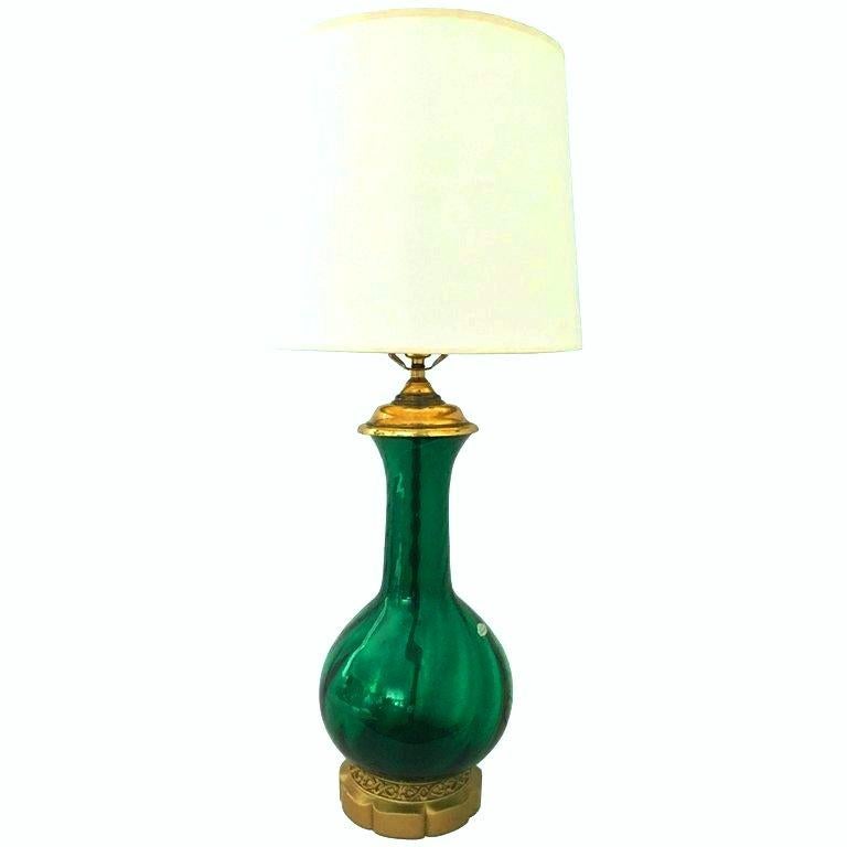 Midcentury Blenko glass optic emerald green and brass mount table lamp. This sparkling Blenko glass lamp maintains its original Blenko glass silver manufacturer sticker. Features the original brass base and fittings. Includes a brass harp and