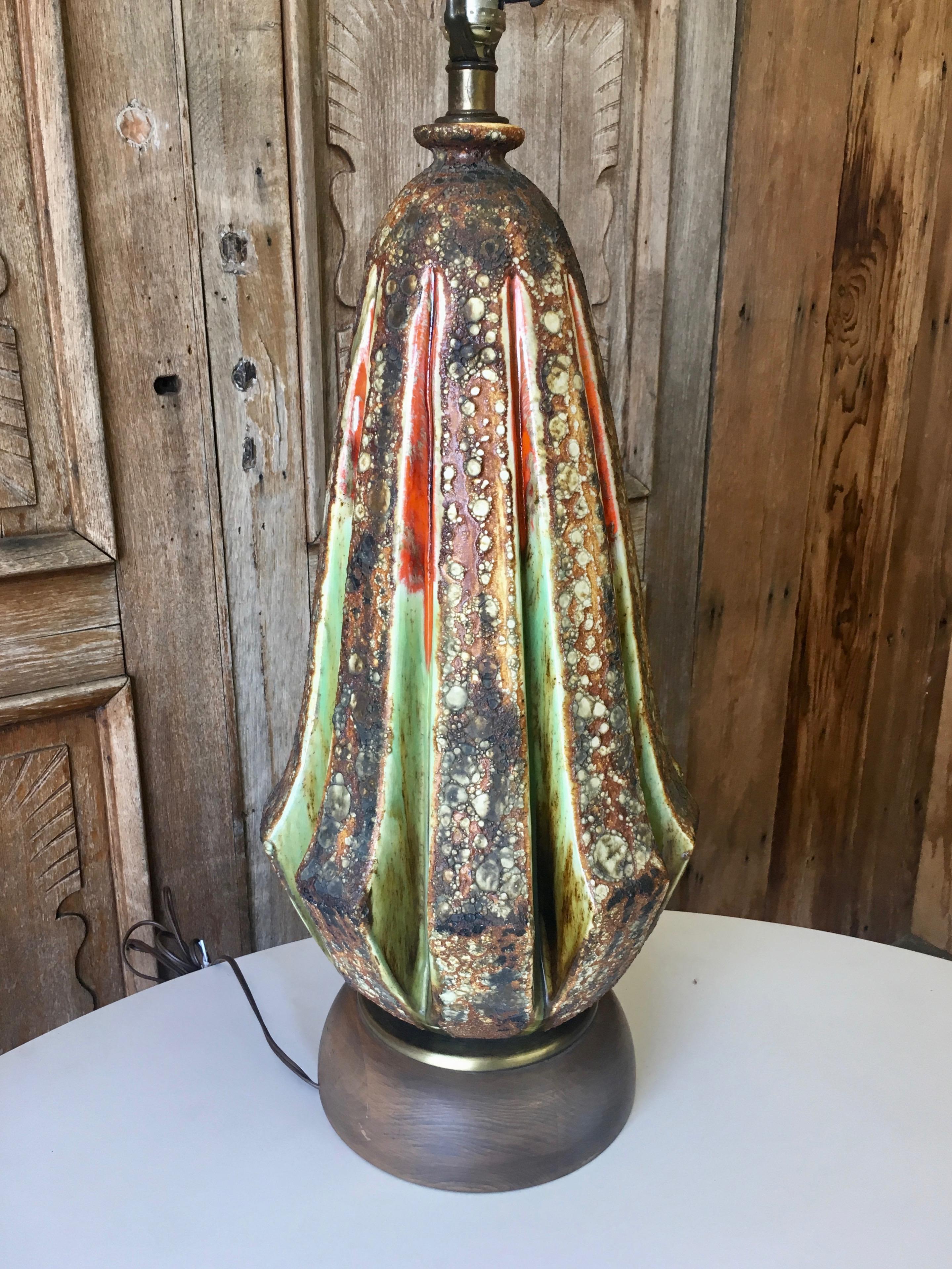 Sculpted ceramic table lamp with blister glaze in multicolored spectrum.