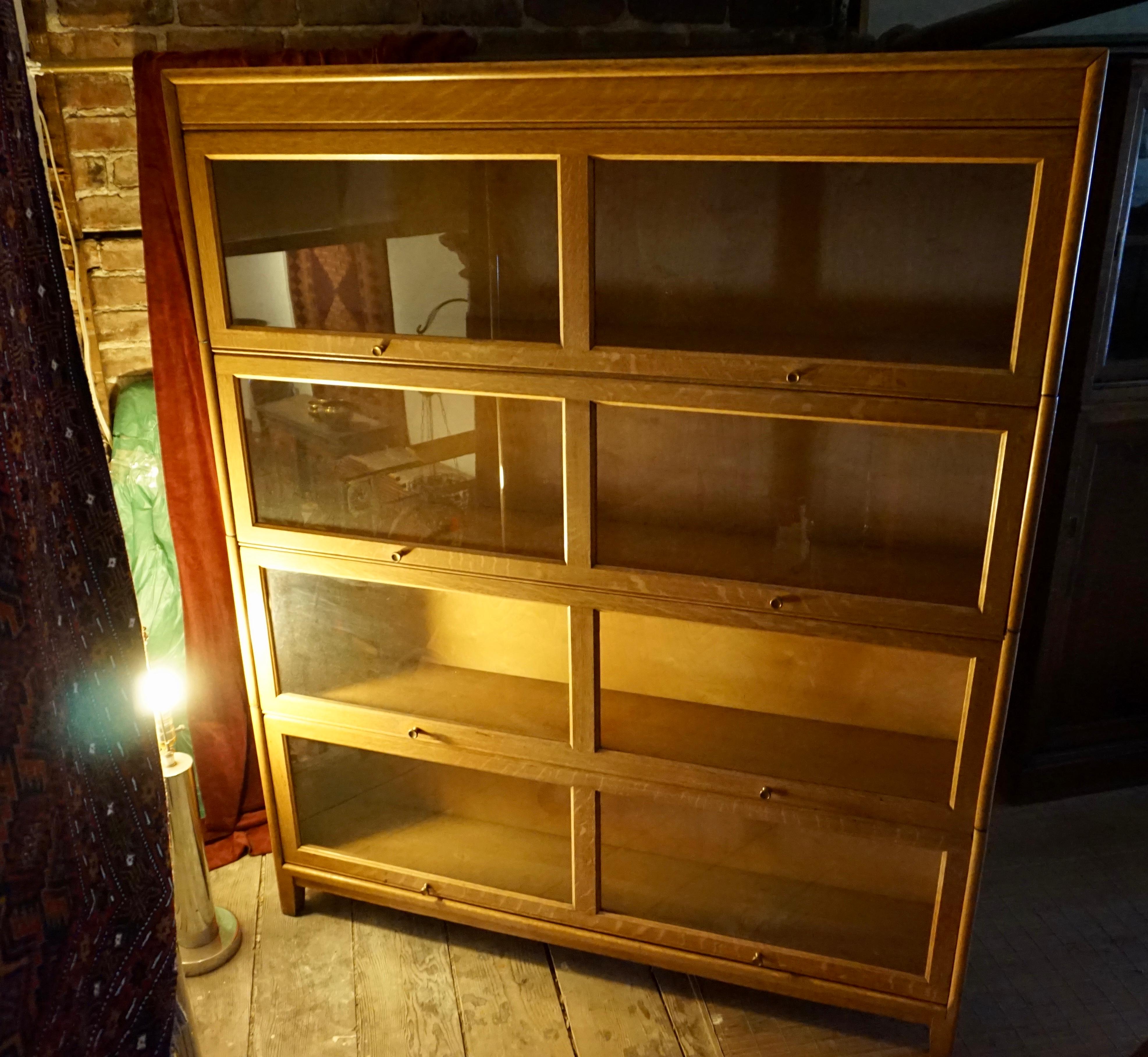 Well constructed blonde oak barrister in good condition with brass knobs and sound mechanism. Dismantles easily on raised base, nice size. Shows beautifully...

circa 1950s.