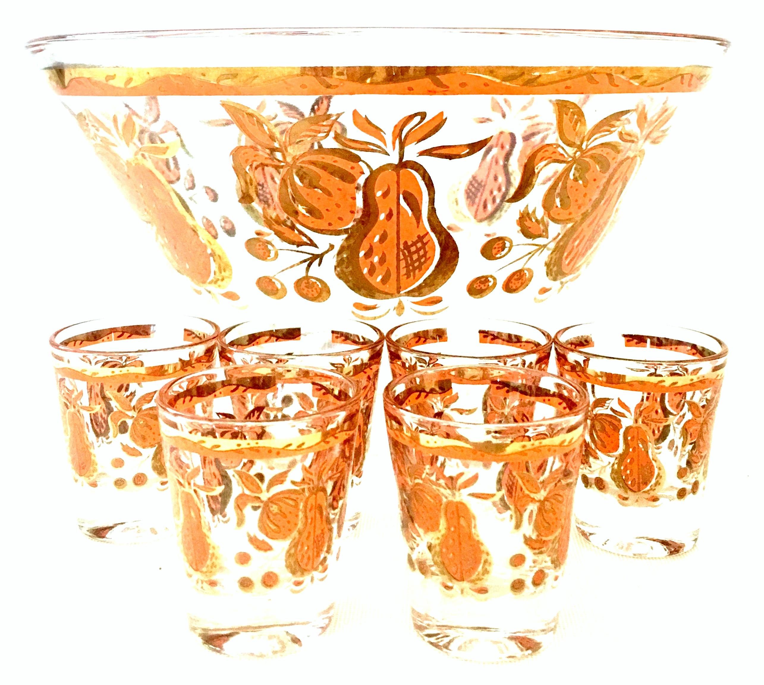 Mid-20th Century blown glass & 22-karat gold drinks set by, Georges Briard and Blenko glass-set of eleven pieces. Set includes one large serving bowl and six shot glasses by Georges Briard and four textured tumblers by, Blenko Glass. The Briard bowl