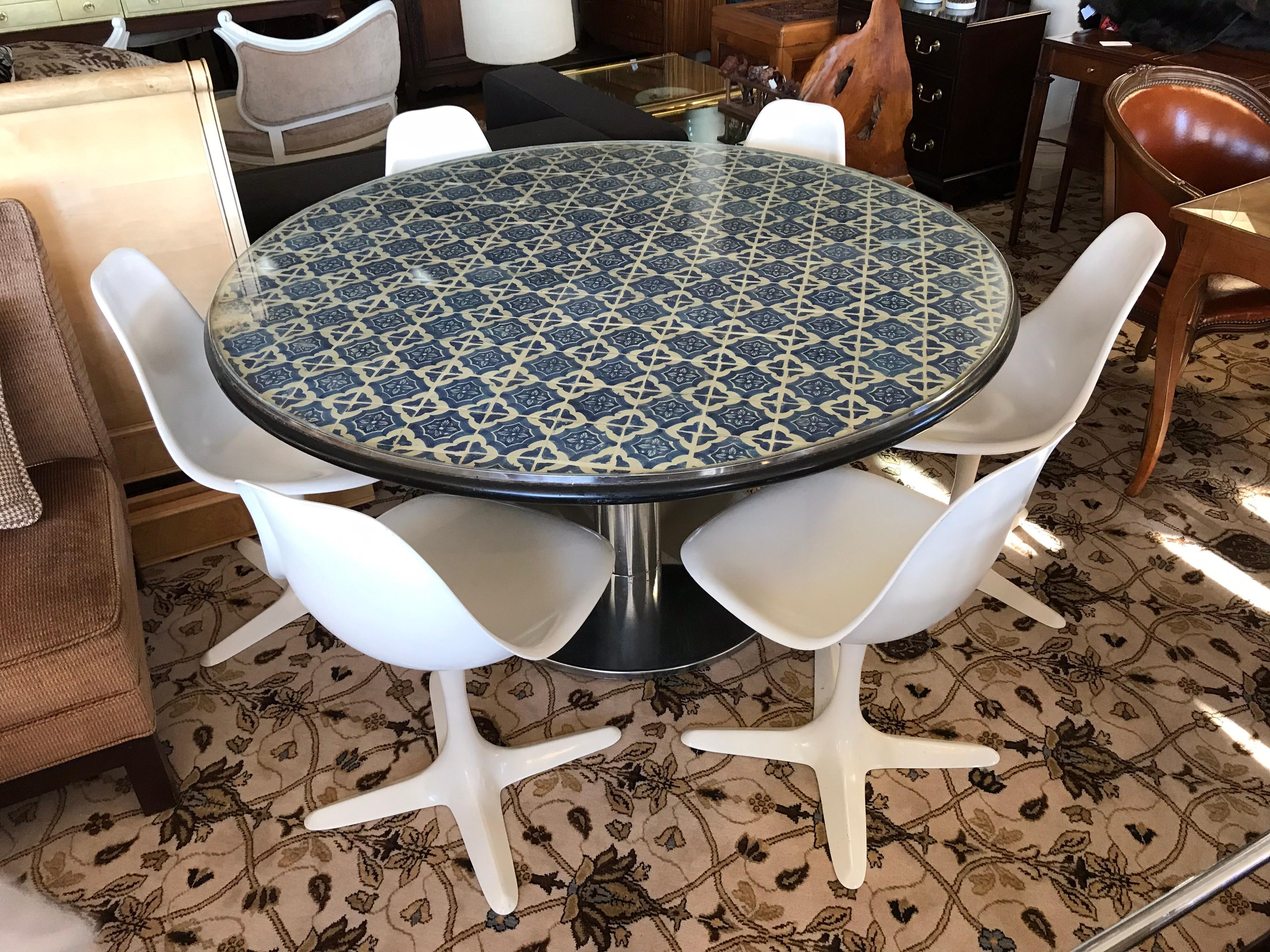 Unusual blue and white Spanish tile top mosaic table with a set of six Saarinen tulip chairs with Burke USA hallmarks. True period pieces. The table dimensions are below and the chair dimensions are 18 x 20 x 32 x 18 inch seat height. Magnificent