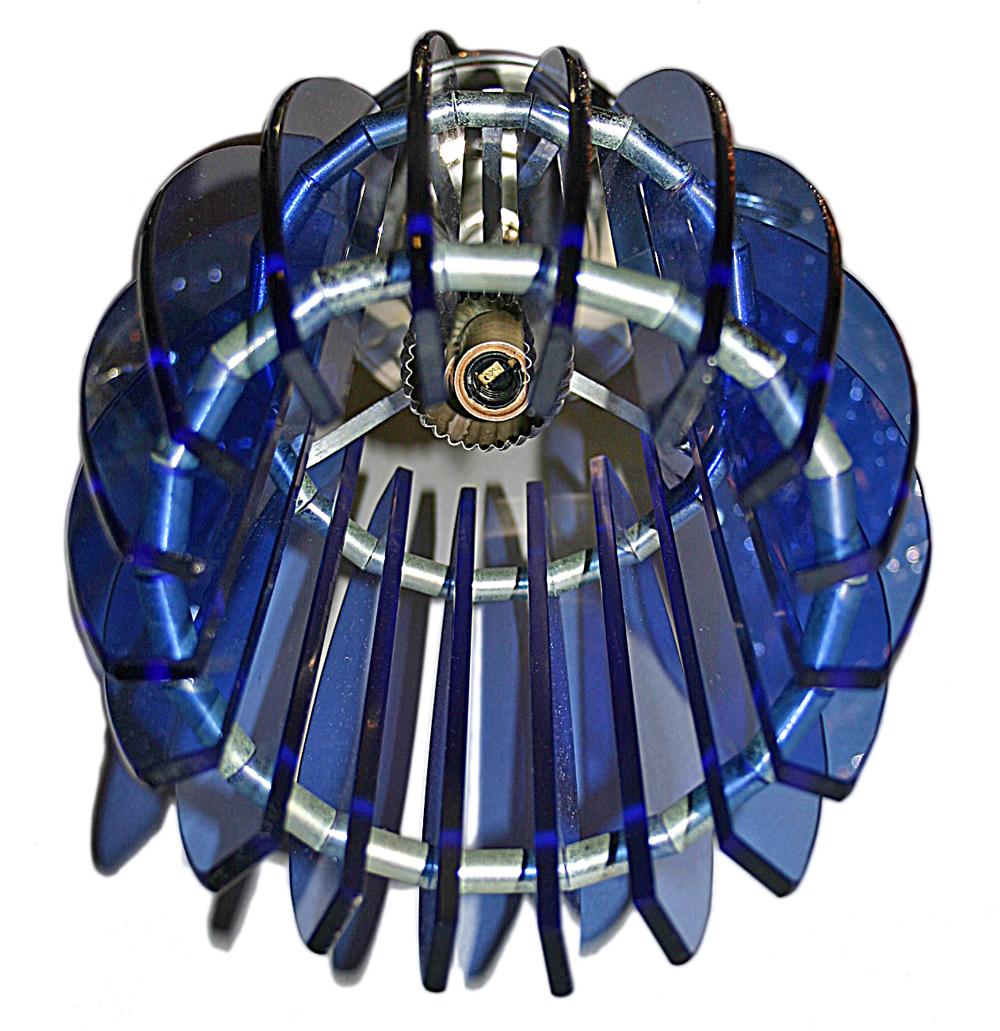 A circa 1960's Italian moderne pendant light fixture with cobalt blue glass insets.

Measurements:
Height of body: 16.5