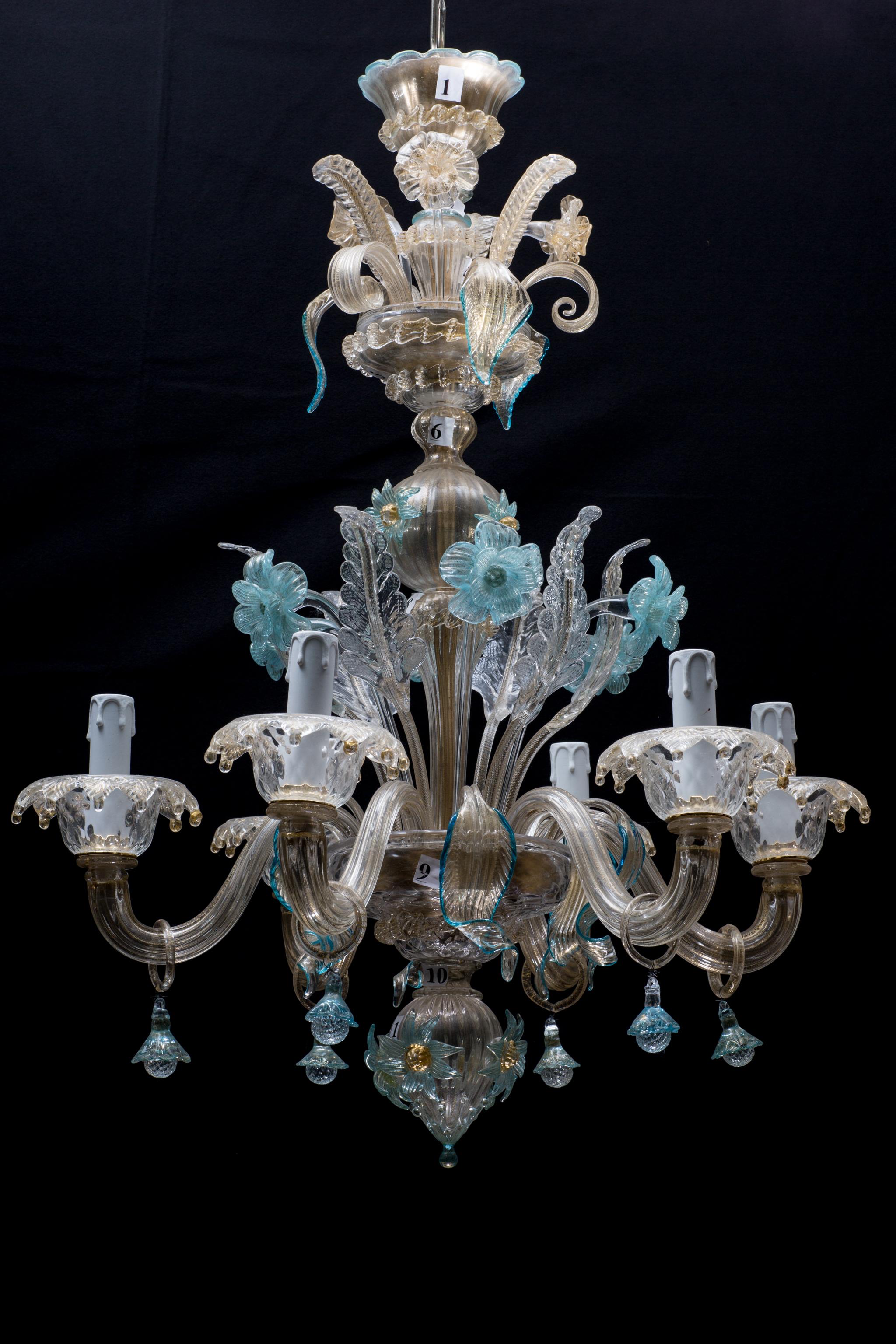 A unique midcentury Italian Murano glass chandelier from Venetia by Galliano Ferro.
The whole chandelier is embedded with 24-karat gold. This light has two levels, and because of that is also called Castelletto which translates to little castle. At