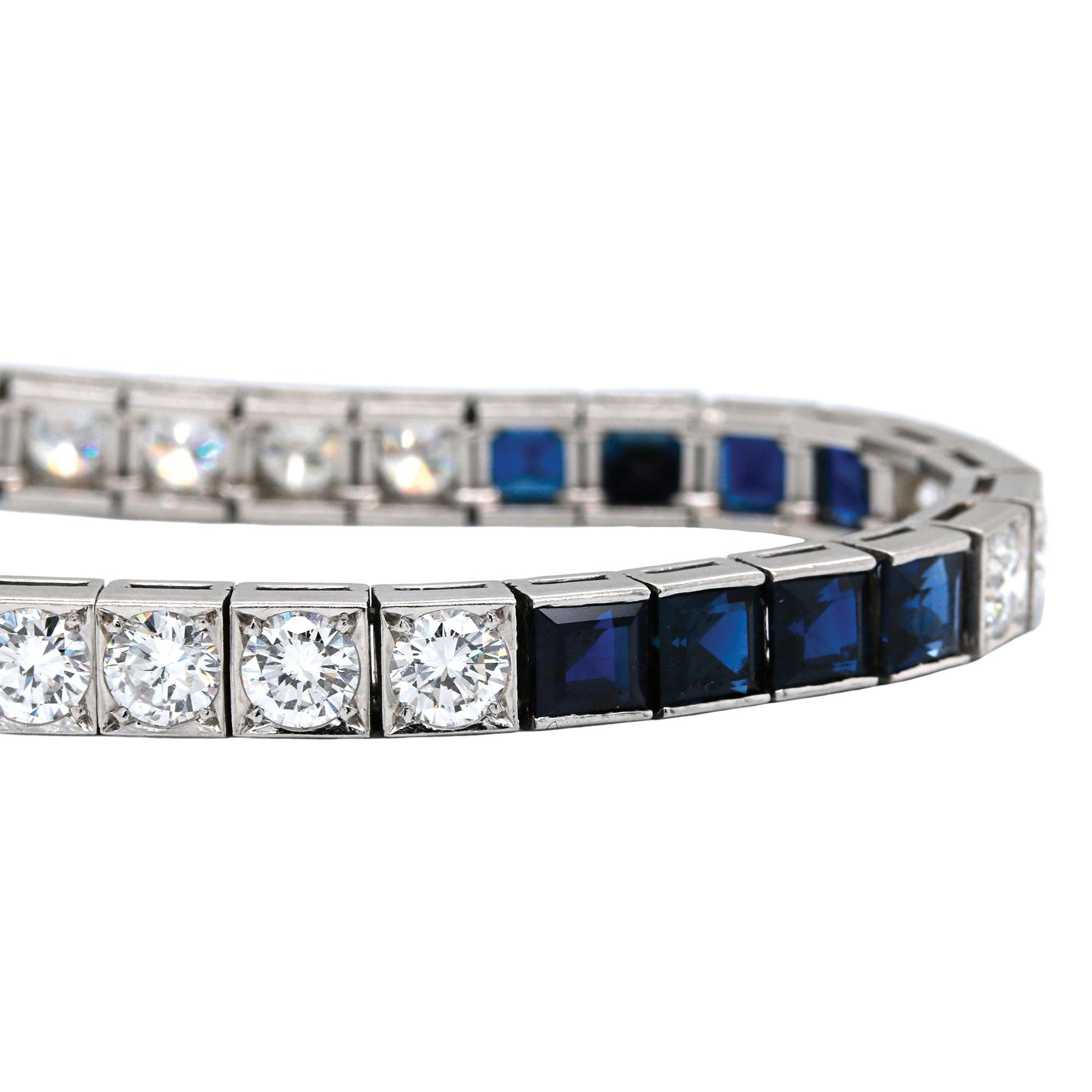 This wonderful vintage piece features 9.80ctw of vibrant blue sapphires combined with 5.30ctw of sparkling round brilliant cut diamonds. The diamonds are graded G-H in color and VS1-2 in clarity and form a beautifully dramatic contrast to the deep