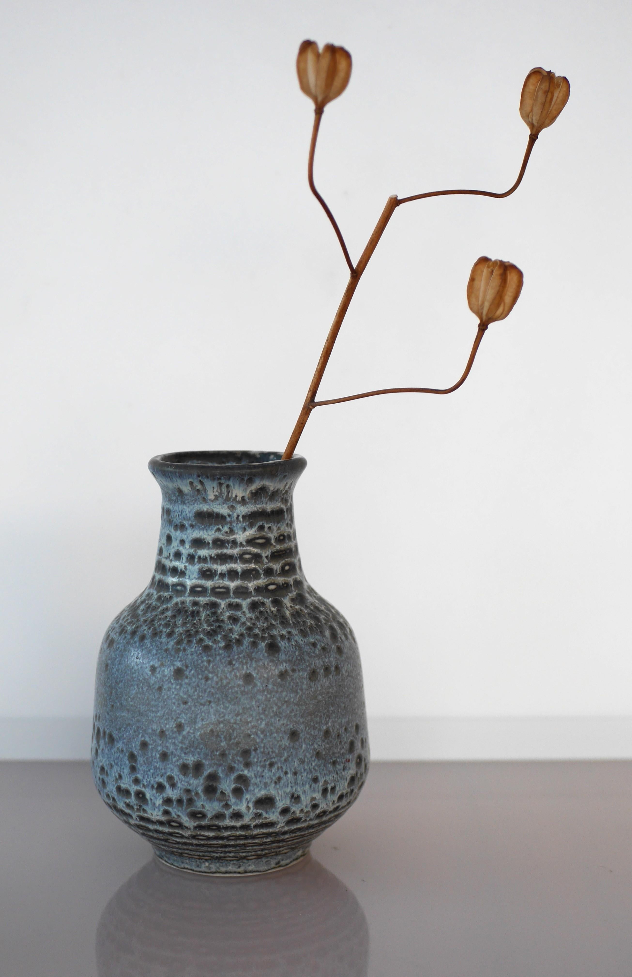 An extraordinary and rare hand-made vintage ceramic vase design by the very talented Gunnar Nylund for Rörstrand. What makes this vase so very special is that even though, it has a very simple design, it has the most elegant and sophisticated