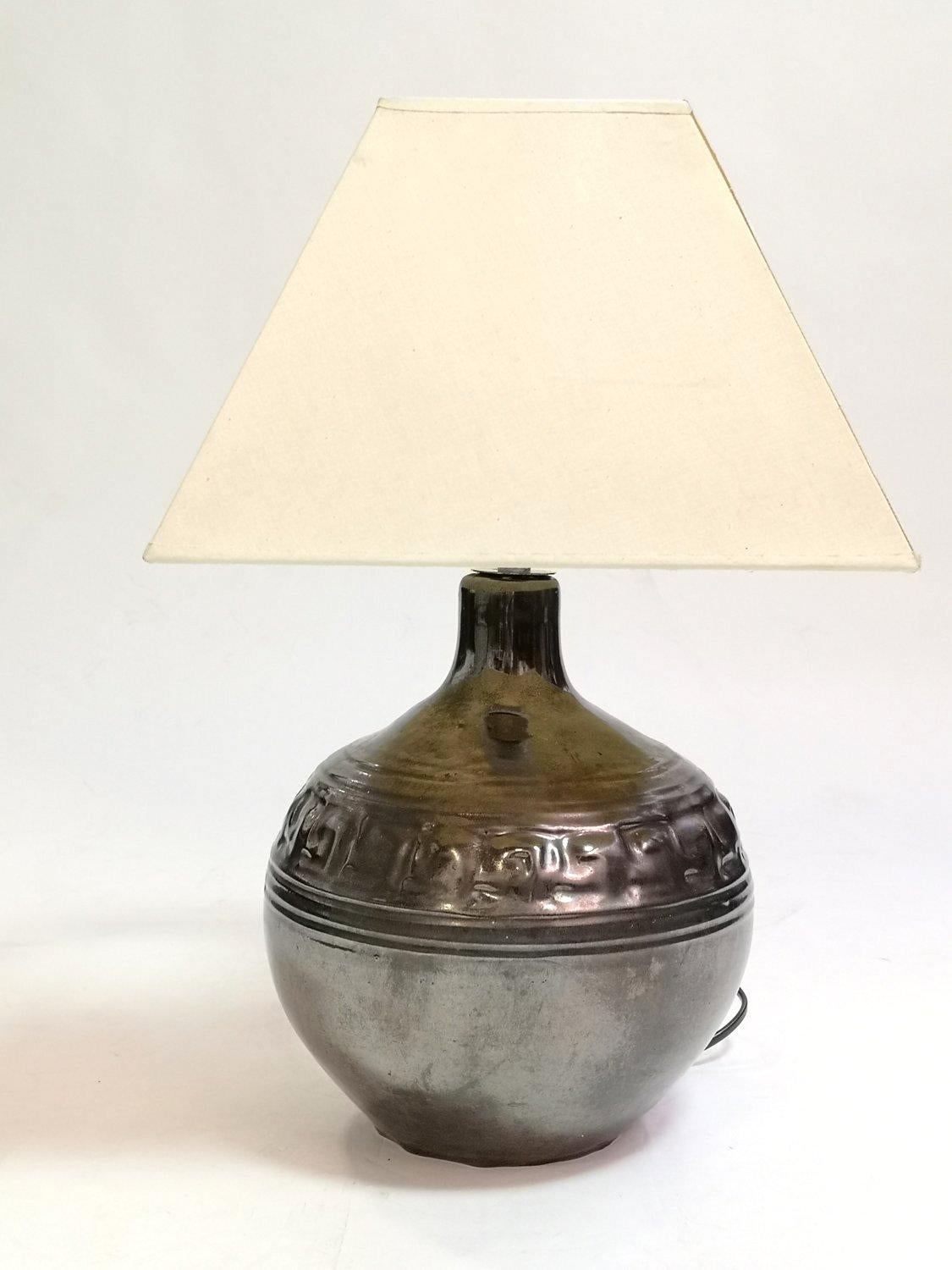 Special vintage ceramic table lamp, dark ceramic base coated with iridescent luster glaze, off-white cube lampshade. Unique handmade piece from the 70's. This special piece is in perfect working condition.
