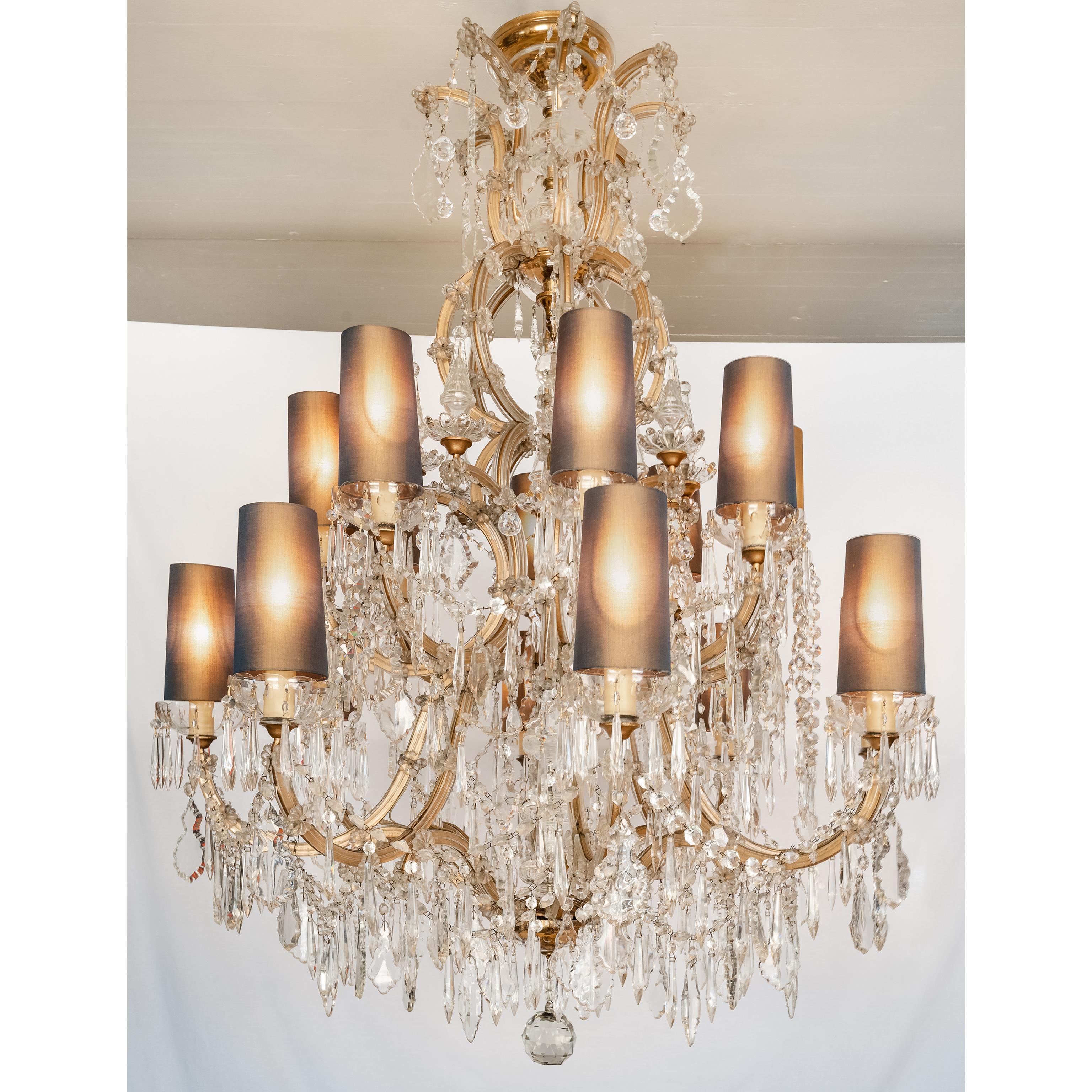 Mid-century Bohemian Marie Therese Baccarat Style 16 Light Crystal Chandelier, 1930's.
Rare and large Italian Marie Therese sixteen light crystal chandelier with a shaped central stem surmounted by beautifully contoured scrolling arms. These lovely